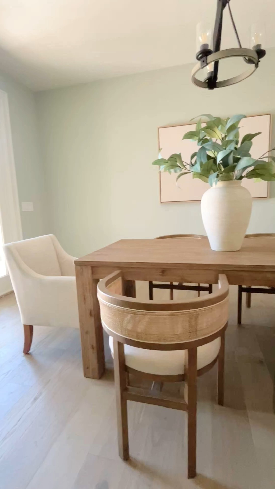 Beautiful wood rectangle dining table with curved cane back accent chairs.  Cream upholstered end chairs.

#diningroom

#LTKHome