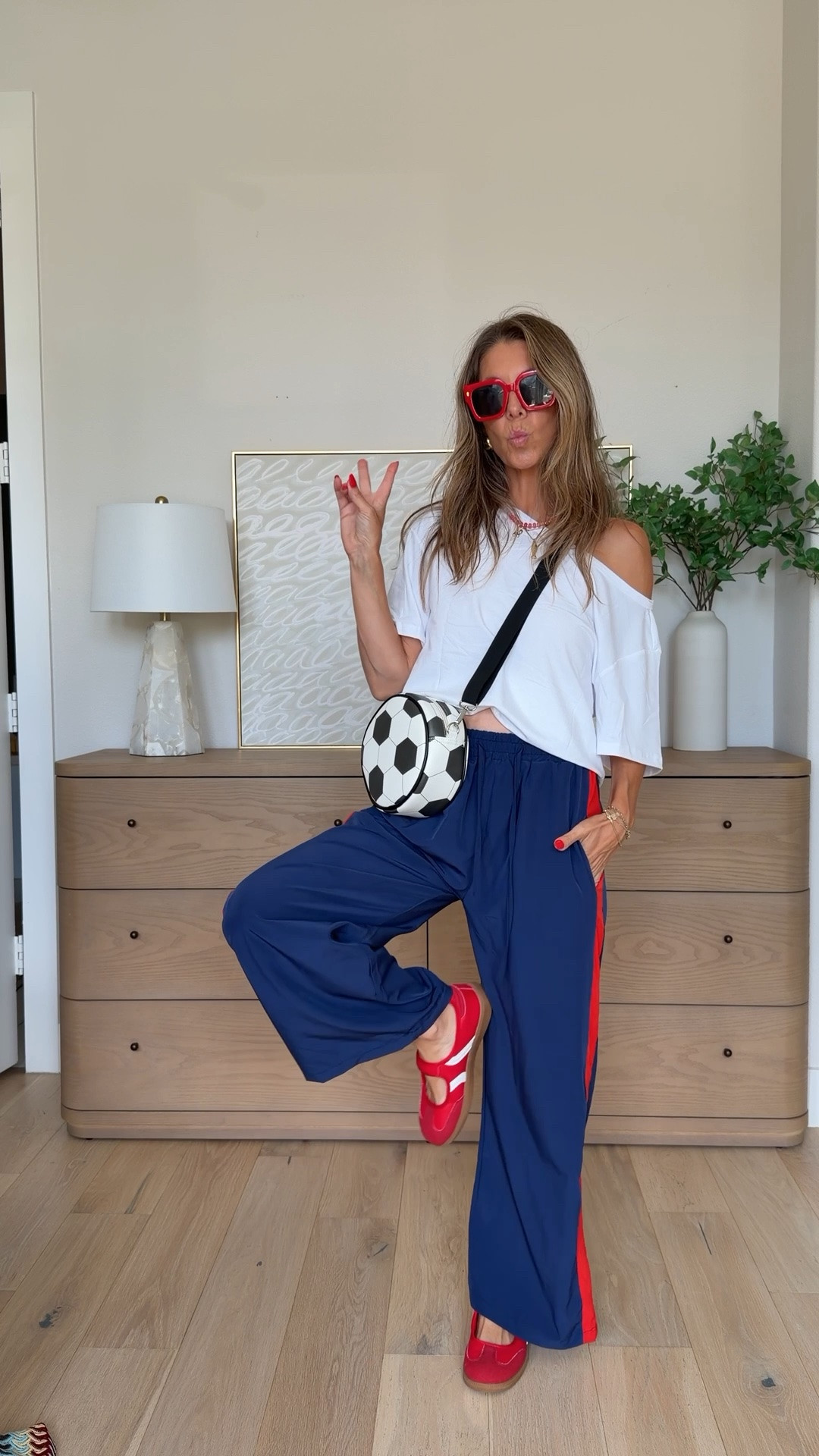 Love these Amazon track pants!! Size XS - lots of color and print options and only $29.99!!! Off the shoulder white tee is a great staple! Mary Jane sneaker look for less! Soccer ball purse old navy

#LTKSaleAlert #LTKootd #LTKdayinmylife