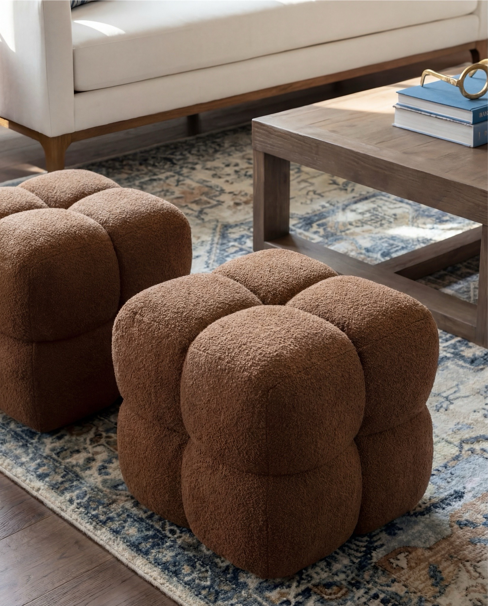 Shop the Look:
• Cream upholstered sofa (clean modern lines)
• Wood frame accent chairs with light neutral cushions
• Warm brown boucle cube ottomans
• Medium wood square coffee table
• Blue and beige vintage-style area rug
• Marble fireplace surround (white with soft veining)
• Dark wood ceiling beams
• Round wood fluted side tables
• Small ceramic table lamps (warm neutral base)
• Blue ceramic decorative vase
• Neutral textured throw blanket (warm brown)
• Blue linen accent pillows
• Floating wood wall shelves
• Wood storage cabinet with brass bird knobs
• Abstract neutral wall art (warm brown tones)
• White globe pendant light

#LTKHome #LTKSaleAlert