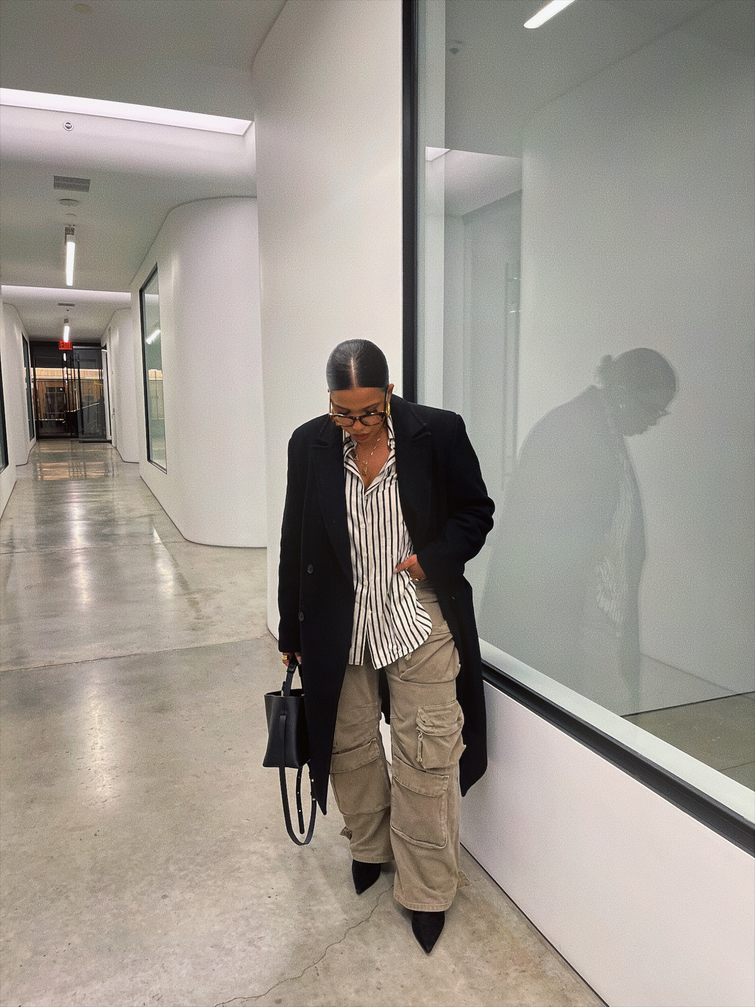Black peacoat, pointy black boots, striped button down, multi pocket cargo pant, tortoiseshell glasses 

#LTKstyletip #LTKmidsize #LTKbeauty