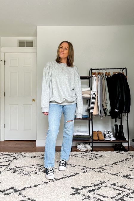 Casual outfit idea. Oversized sweatshirt. Straight leg jeans. Converse high top sneakers.

Sizing
Sweatshirt is a medium.
Jeans are a 6 (one size up from my usual size 4).
Converse run TTS.

#LTKstyletip #LTKunder100 #LTKunder50