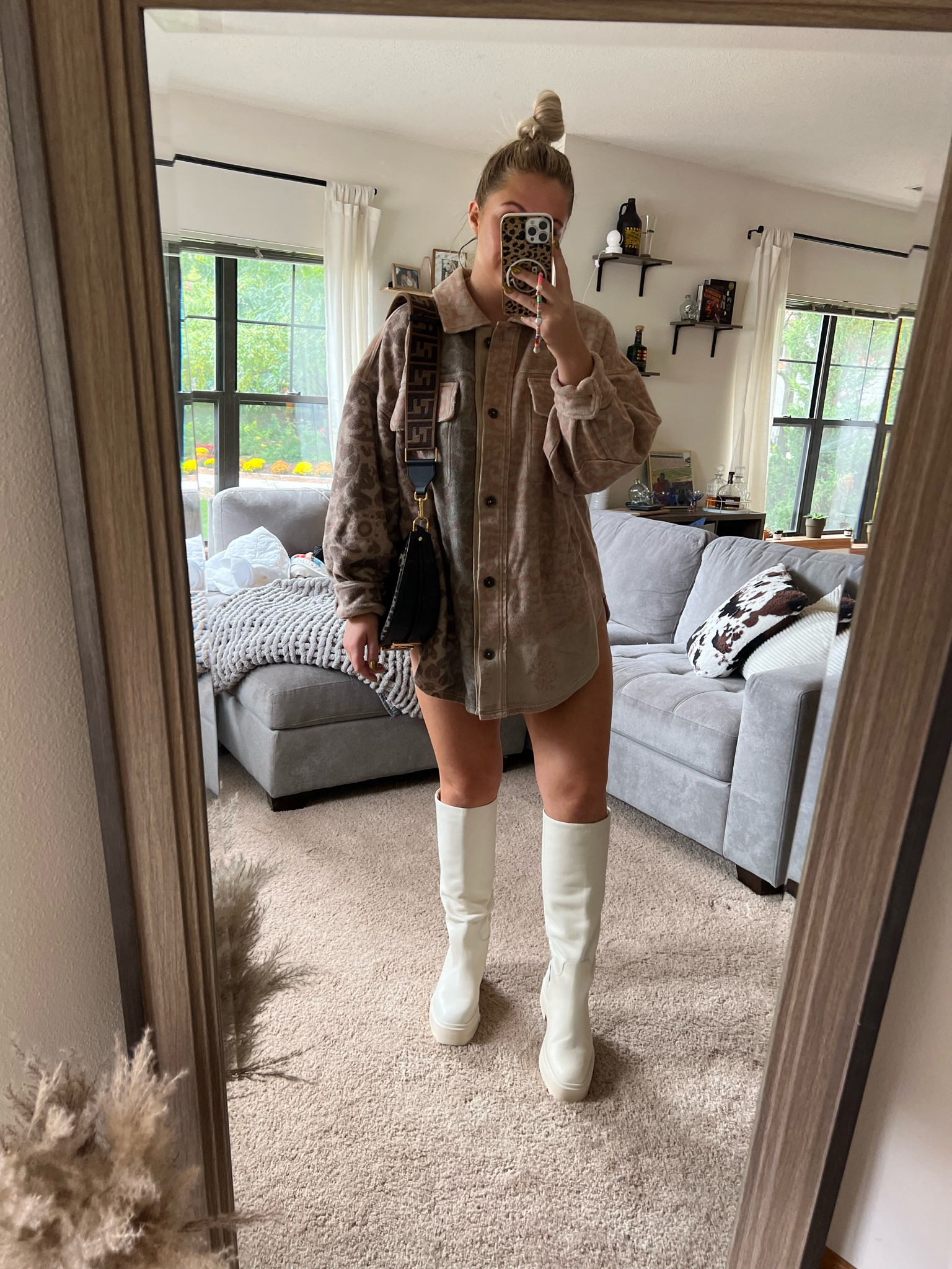 Medium in the jacket. Love pairing it with biker shorts and wearing it as a shacket dress! 