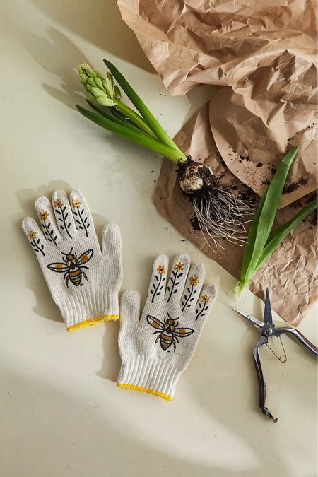Crafted with care in Utah, these hard-wearing garden gloves are a must-have for every garden enthusiast. Each glove is beautifully screen-printed with intricate bees and leaves that delicately climb up every finger, adding a touch of nature-inspired elegance to your gardening routine. With rubber grips on the palms, these gloves ensure you can tackle even the toughest weeds with ease.

**Key Features:**
- **Hand-Screenprinted in Utah:** Unique bee and leaf design crafted with local artistry.
- **Rubber Grips:** Enhanced grip for handling the most stubborn weeds.
- **Durable Material:** Built to withstand the rigors of gardening.

**About My Little Belleville:**
Founded by illustrator Michelle Christensen, My Little Belleville is inspired by the vibrant, multicultural arrondissement of Belleville in Paris. Michelle brings her global inspirations back to the USA, creating products that not only reflect French charm but also celebrate worldwide diversity. Each item is designed to make you smile, spark conversations, and help you stand out with a unique flair.

Shop now and add a touch of elegance to your gardening!

#LTKHome #LTKFindsUnder50 #LTKSeasonal