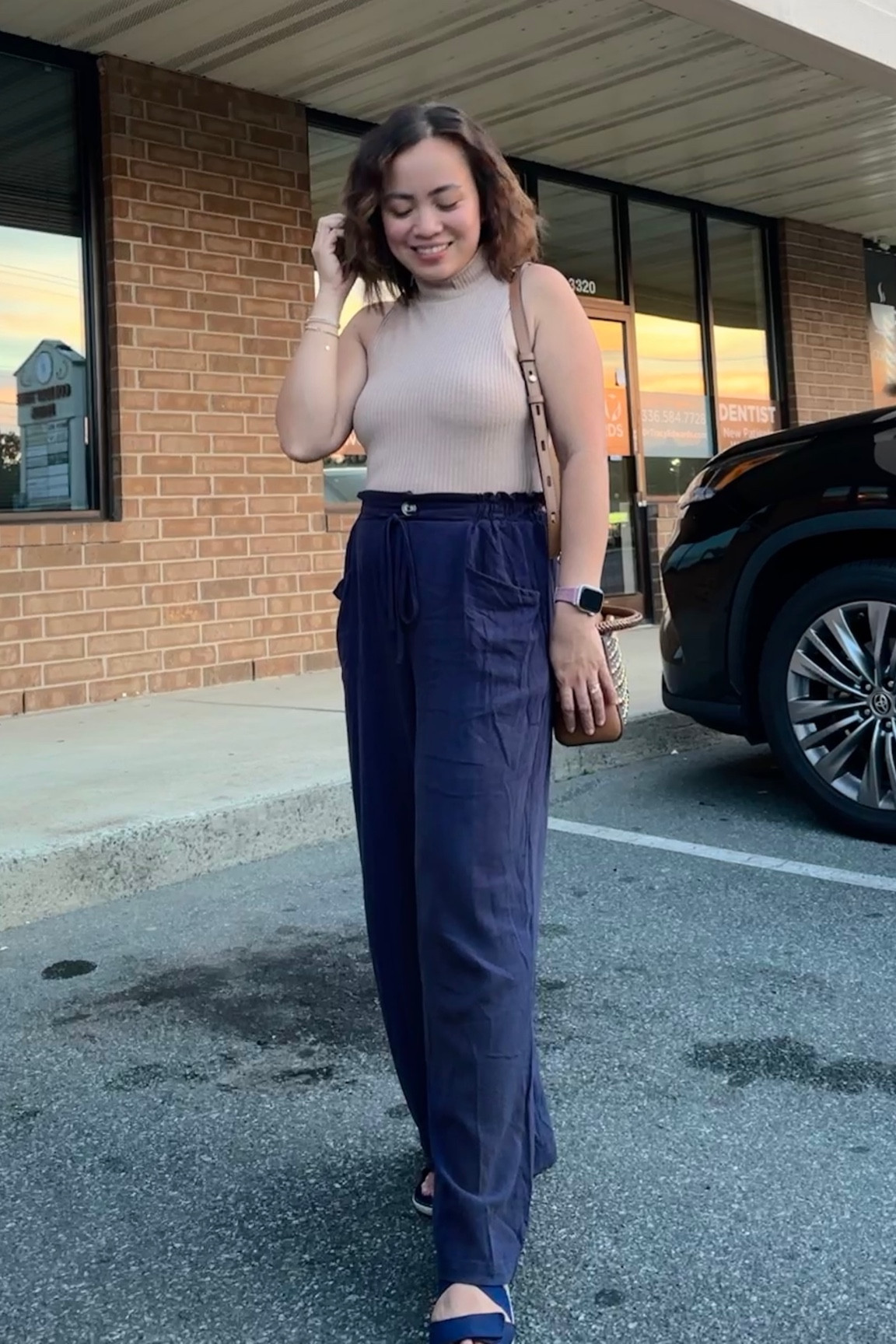 Stepping into the day with confidence: Navy blue wide-leg trousers paired with a fitted apricot tank top, topped off with navy blue velvet wedge sandals. 💙✨

#LTKstyletip