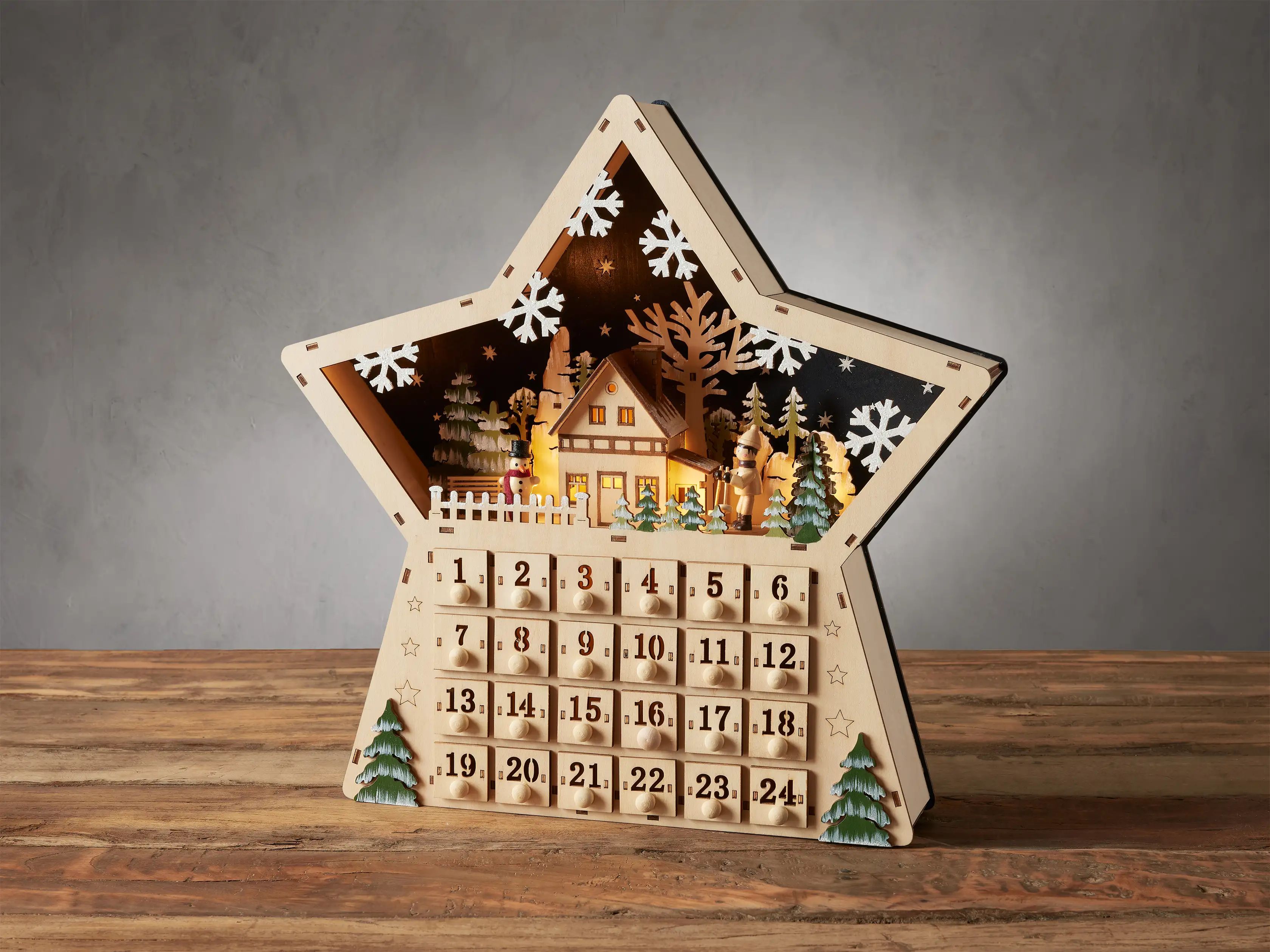 Celebrate every day this holiday season with this charming star-shaped Advent calendar topped wit... | Arhaus