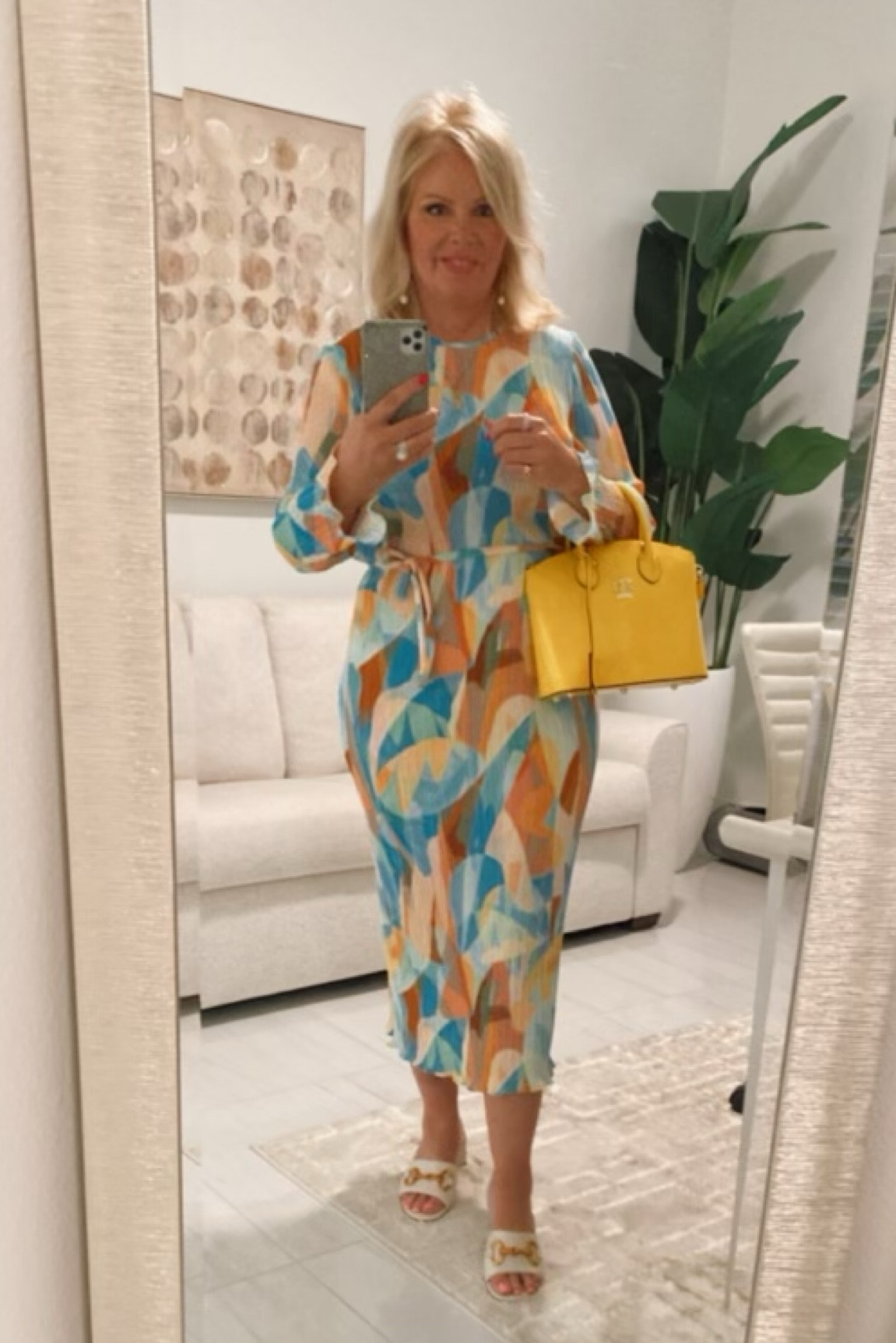 Add some color and patterns to your wardrobe. This dress is perfect for any occasion… wedding, girls day, vacation, date night! Choose a color on the dress and pick a bag in the same color. Instant pop! 