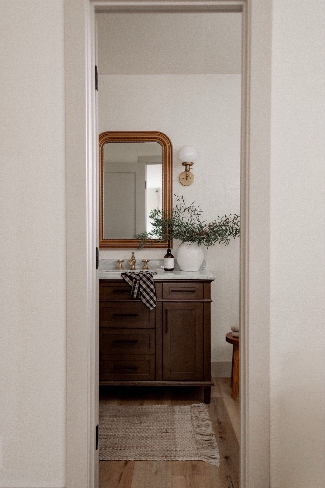 Create a designer look for less in your bathroom with this gorgeous wood vanity (40% off right now!), gold mirror, and bathroom decor.

#sconce #primary #guest #neutral #fall

#LTKSaleAlert #LTKHome #LTKSeasonal