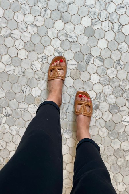 Valentino Vlogo slides. Valentino Sandals I wear an 8.5-9 and got a 38.5. They do run a bit narrow fyi. Come in several colorways. 
I also linked a look like option that is on sale under $100. #designershoes #slides #valentinoslides #sandals 

#LTKstyletip #LTKshoecrush #LTKover40