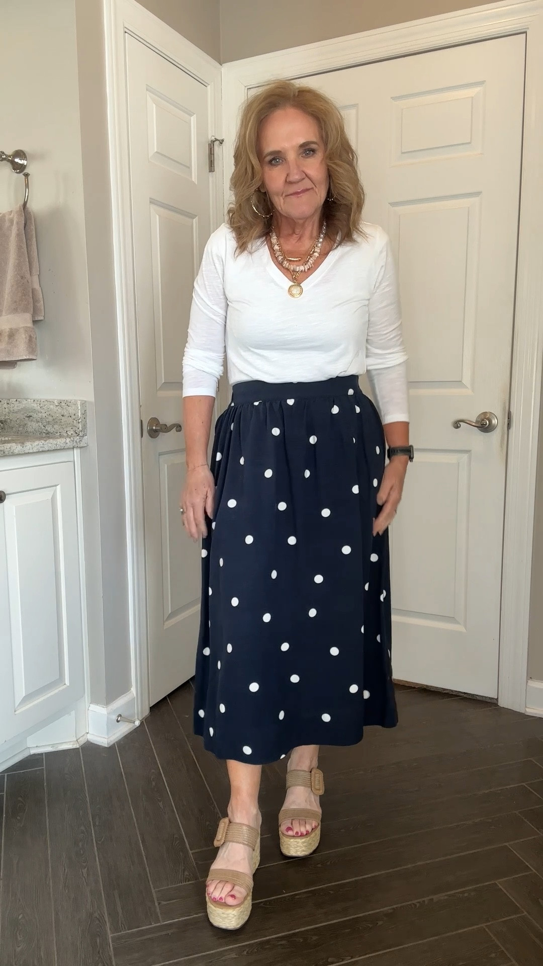 Super cute polka pots linen like skirt wearing size medium 
White t-shirt comes in short and long sleeves wearing size small 

Spring skirt spring fashion 

#LTKOver40 #LTKFindsUnder50 #LTKWatchNow