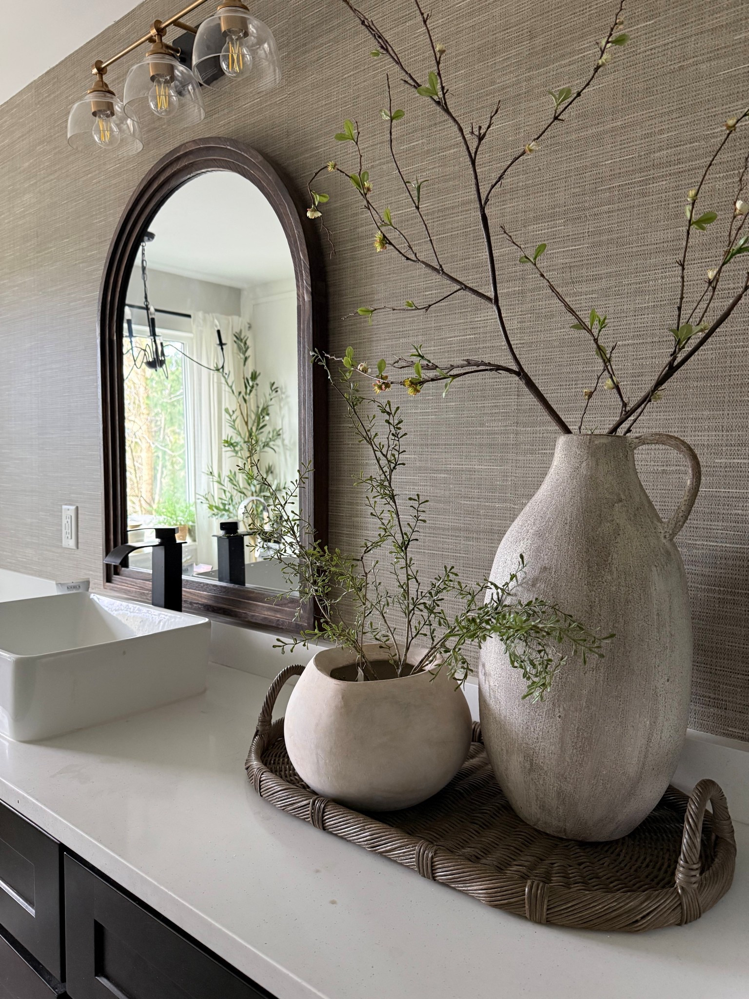 Bathroom ..spa vibes only. 
Keeping our primary bathroom clutter free isn’t easy..but I just love the peace when it is! An organic look with this minimal greenery is calm and serene…like a spa✨
Luckily we have a large vanity and drawers for all the bathroom essentials.
