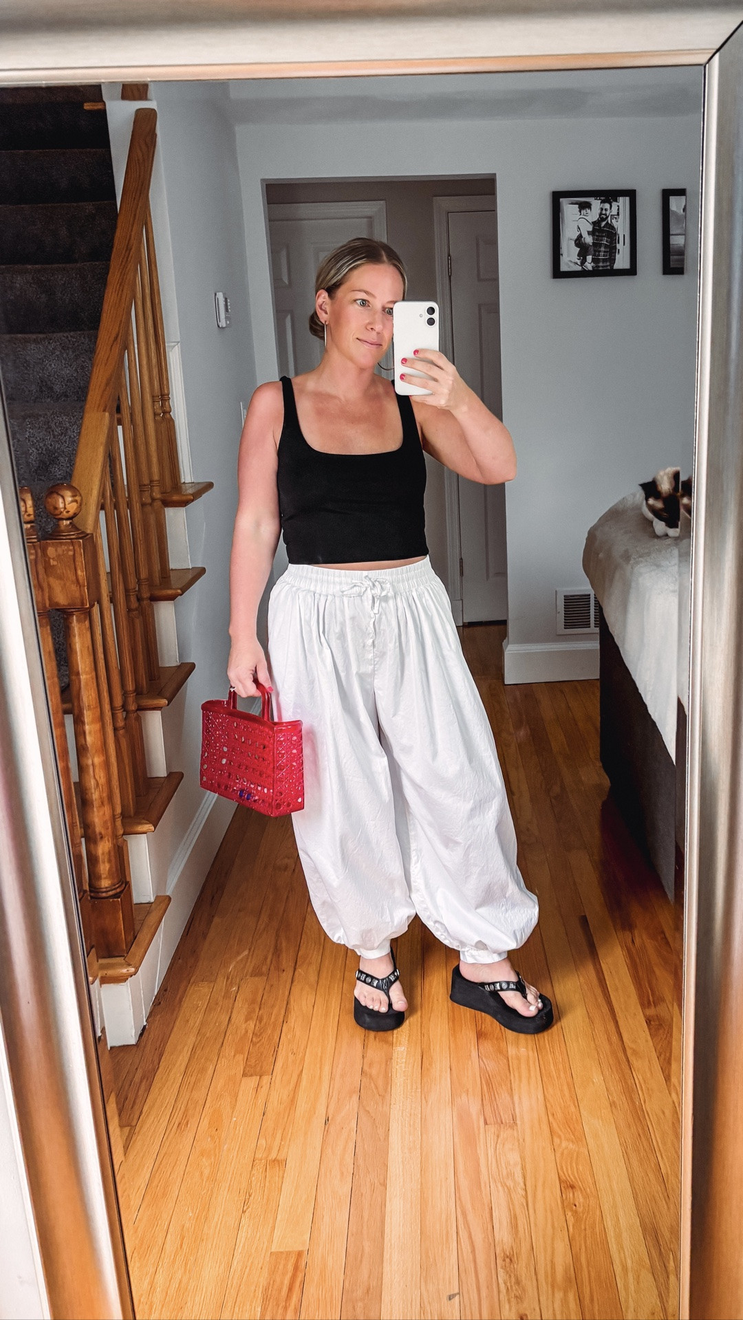 White poplin balloon pants 
Red jelly handbag
Studded black platform thong sandals 
Square neck black tank

#LTKSaleAlert #LTKSeasonal #LTKootd