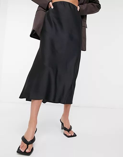 ASOS DESIGN satin bias slip midi skirt in black | ASOS (Global)