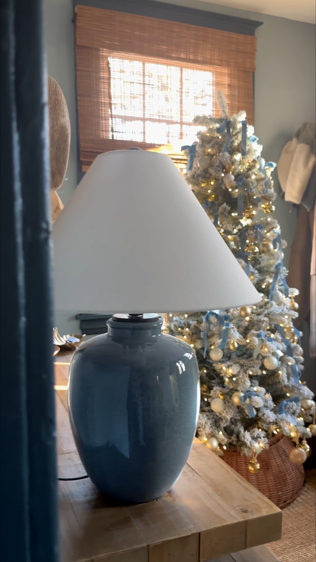 The blue room lives on 🩵 In years past, the sitting room held this true adorned with blue ribbon. With our recent renovation, the mudroom became the perfect spot! It glows from the road, to our guests. Get the entire room look:

#LTKHoliday #LTKHome