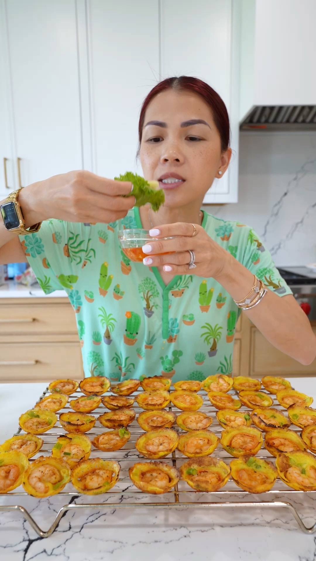 In my video, I am use BANH XEO mix. There is a BANH KHOT mix available… they both do the same IMO.

SHRIMP BANH KHOT
 
If you can get pre mixed batter, you can make it!
 
BATTER:
1 ¾ cup rice flour
¾ cup all purpose flour
1 TBSP turmeric
3 ½ cups water
1 can (14 oz coconut milk)
1 tsp salt
Chopped scallion (optional)
 
SHRIMP
2 lb shrimp
1 tsp paprika
1 tsp garlic powder
½ tsp salt
½ tsp black pepper
1 TBSP olive oil
 
ADDITIONAL INGREDIENTS
Oil for cooking
Lettuce and herbs for serving
 
1.        Combine all of yoru ingredients listed under batter. Let this sit for at least 10 minutes so the batter blooms.
 
2.        Wash shrimp and pat dry. Then season shrimp with: paprika, garlic powder, salt, black pepper and olive oil.
 
3.        When you are ready to cook, you will need an aebleskiver plan. On medium high heat, add some oil to east slot and drop a shrimp into each slot. Then fill each slot up with some BATTER (tip: do not pour batter directly over shrimp. Instead, pour on the side so batter drips UNDER the shrimp. Lert this cook for 4-6 minutes or until bottom is crispy.
 
4.        Option: after 4-6 minutes, flip banh khot over and cook on the other side for 1-2 minutes.
 
5.        Remove banh khot and enjoy as a lettuce wrap dipped in FISH SAUCE. You can add scallion oil over the top of each banh khot but I did not do that.
 
 
FISH SAUCE
1 can coco rico (or 12 oz of water)
2 TBSP minced garlic
¼ cup sugar
¼ cup fish sauce
2 TBSP sambal chili paste
-              Mix this all together. Adjust if needed.