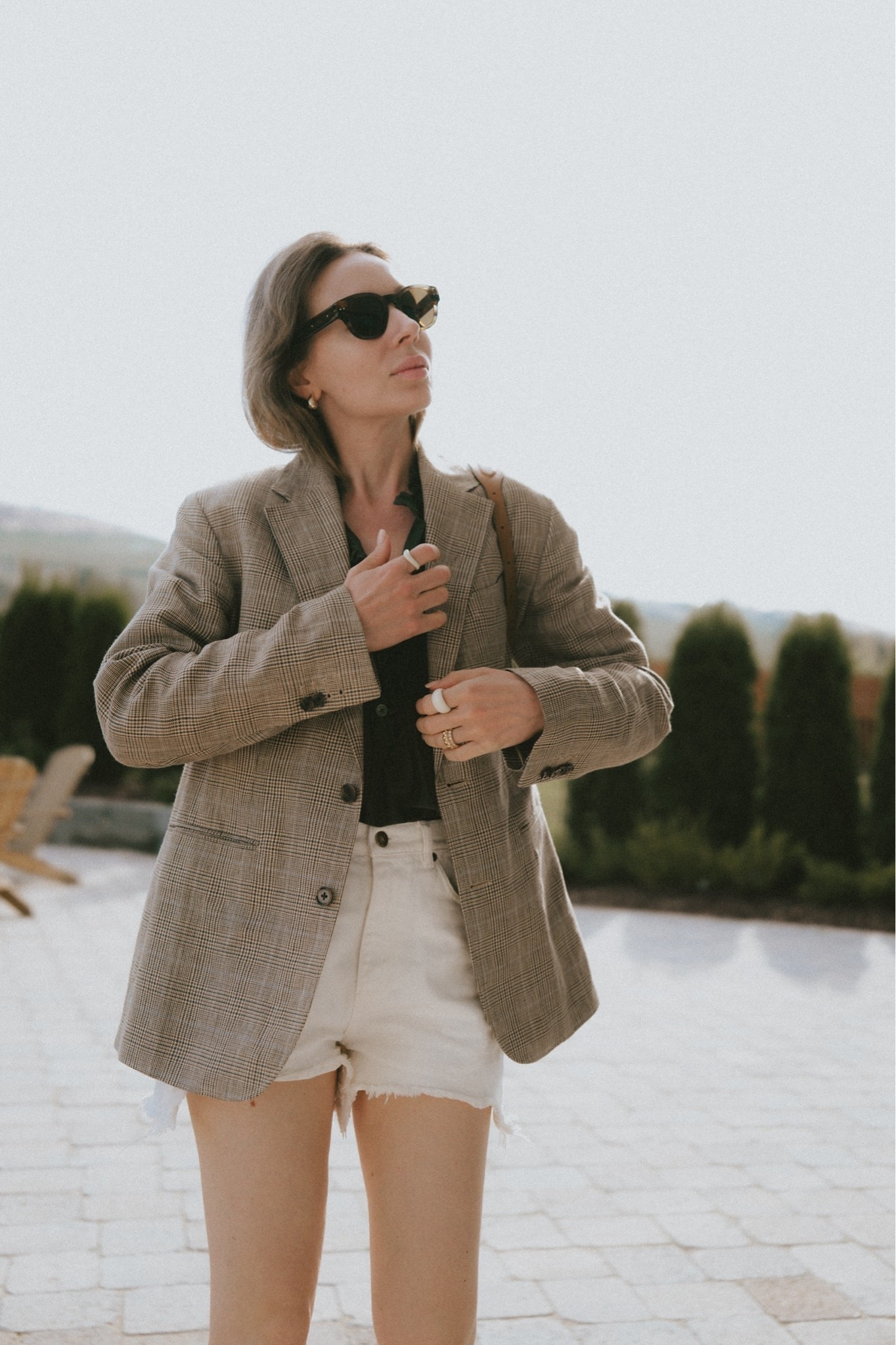 Cut off denim shorts + blazer layered over a tuxedo shirt. 
Earrings: Ross Simon’s 
Blouse: @Zadig And Voltaire 
Shorts: Golden Goose 🪿 
Blazer: Buck Mason
Ring: @Mejuri 
Bag: Polo Lalph Lauren

#LTKootd #LTKmomlife #LTKWorkwear