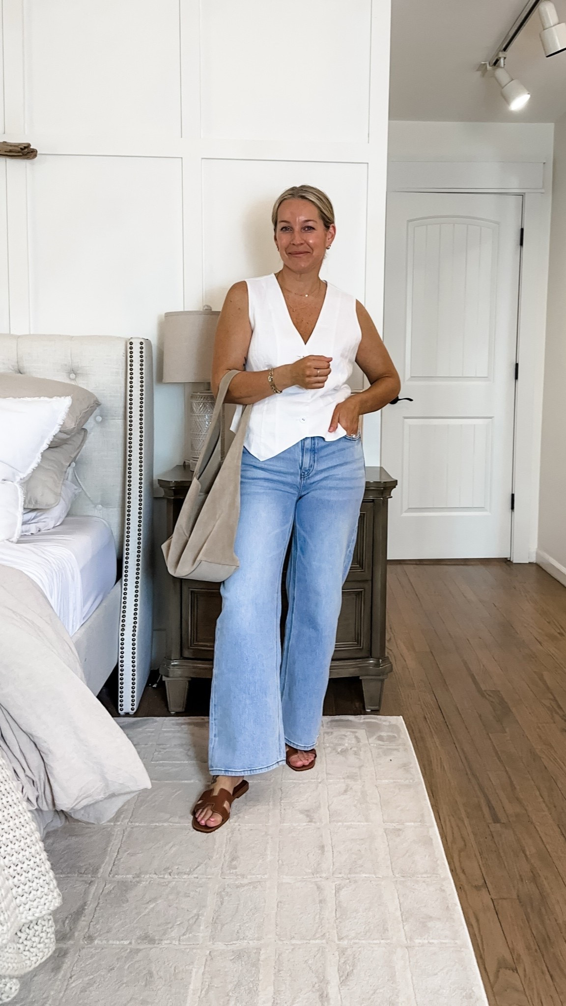 I honestly think having a white linen vest is a must have for the warmer months - it is so easy to style with jeans, trousers or denim shorts and one of my favorite items to wear! I have worn it to concerts with denim shorts and cute sandals, jeans and slip on shoes, trousers and slide sandals for work…so versatile and elevates every look! This one is double lined and super soft! I am in a medium but it does have room on the sides, so I think a small would be a better fit! Enjoy! [29 jeans in color “cool blue”] @Quince  #quincepartner

#LTKPetite #LTKMidsize #LTKootd
