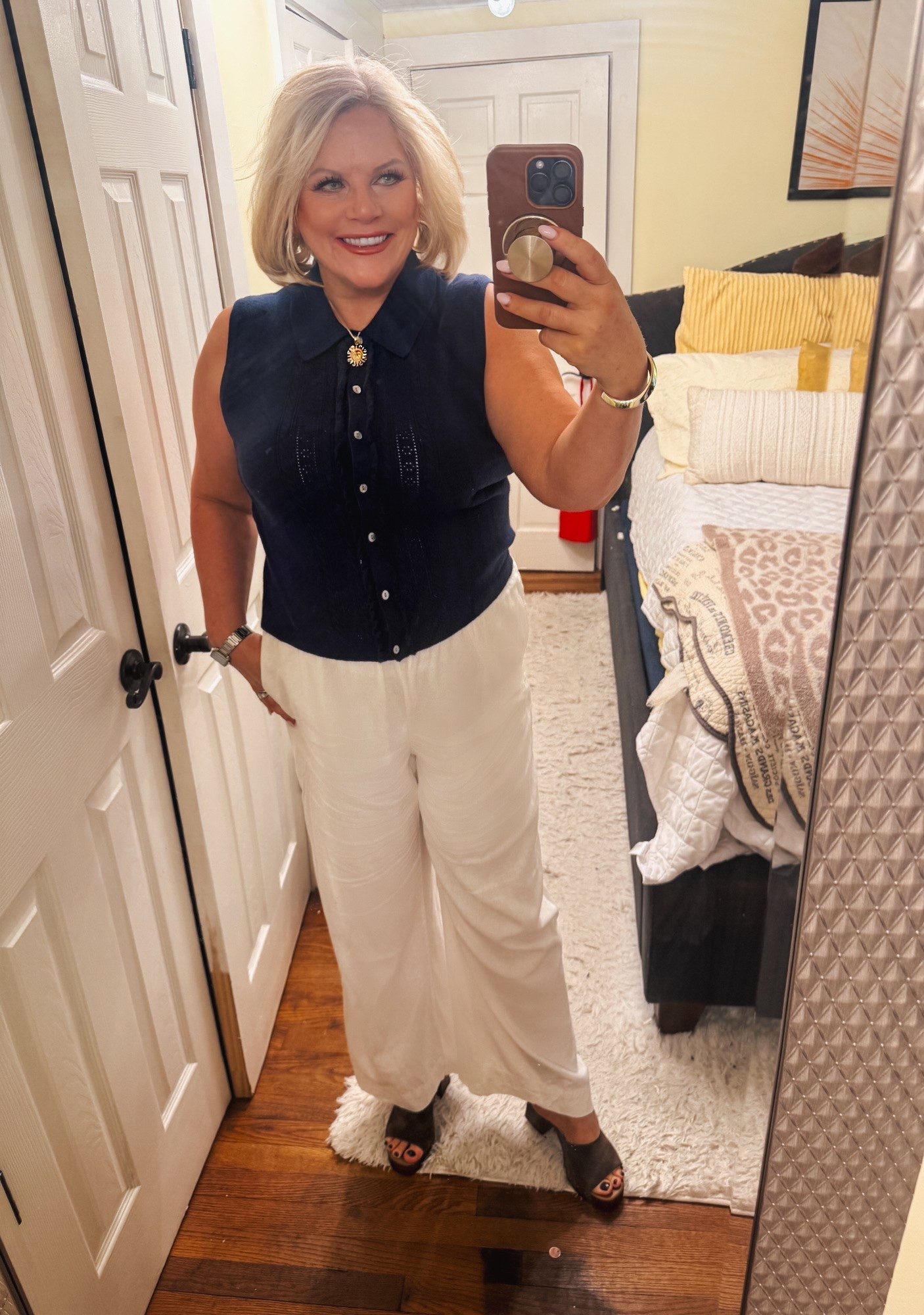 Coming to you today with another business casual office outfit.
This sleeveless cardigan is another piece that works now as I'm wearing it here. It will work in the fall with a long sleeve t-shirt under it.
I'm wearing it now with white linen pants. In the fall, I'll wear it with tan or brown corduroy pants and loafers.

Office outfits, transition outfits, now and fall outfits, ootd, work outfits , over 40

#LTKdayinmylife #LTKWorkwear #LTKOver40
