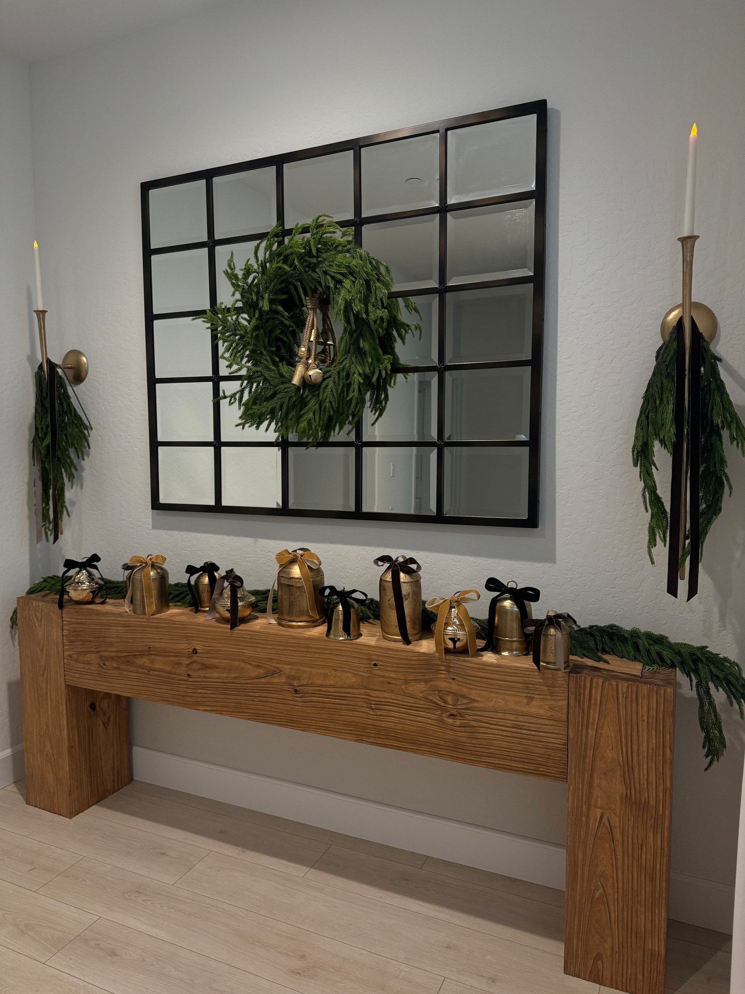 My entryway is officially holiday ready 🎄

I used 2 stems total around the scones so 4 stems total, candles are from hobby lobby. I used two garlands. A couple of the bells I couldn’t link because I sourced them and only found one of each. But I have a total of 11 bells. 

#LTKHoliday #LTKHome #LTKSeasonal