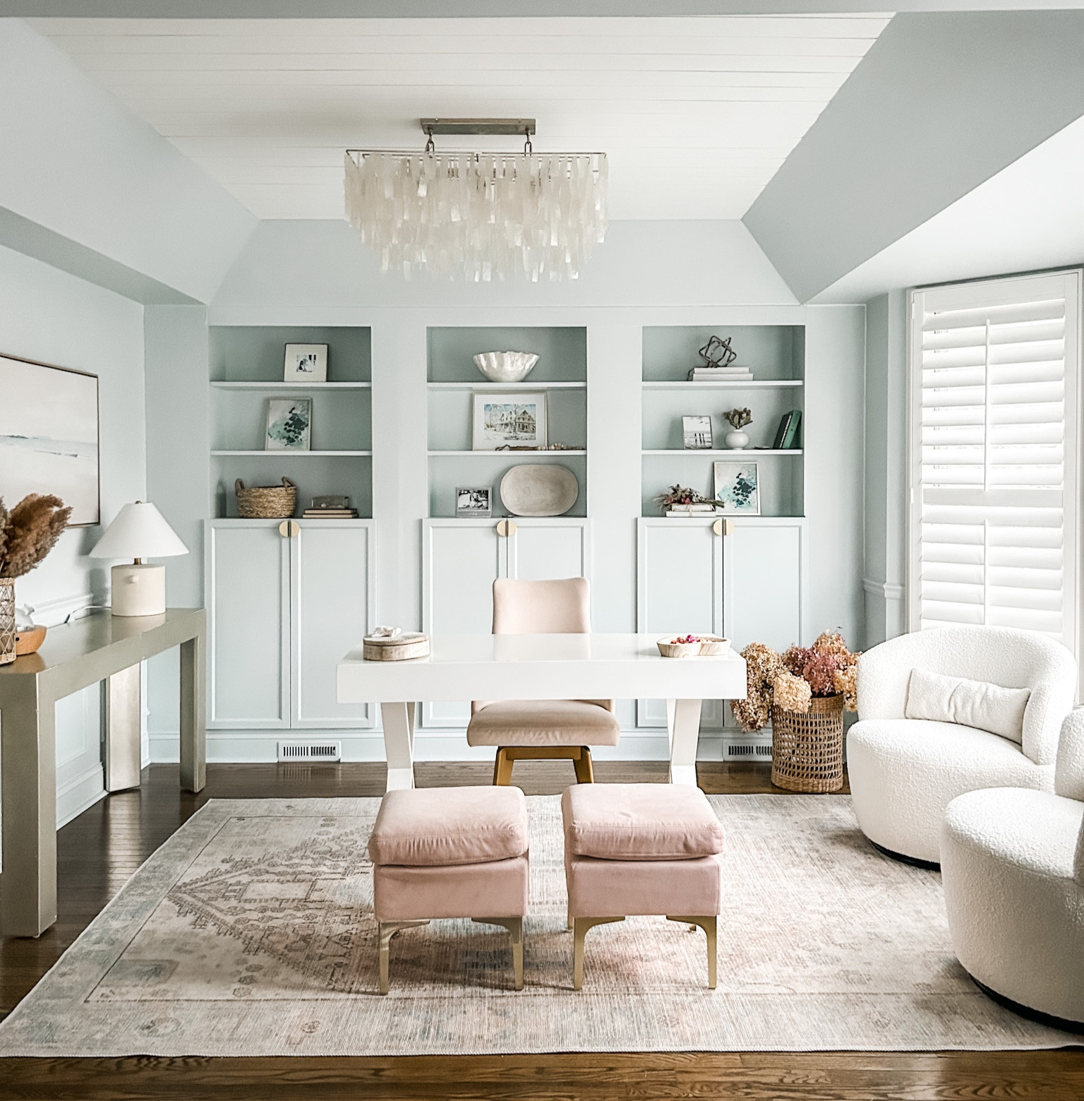 Home Office Decor, Coastal home office, blush area rug, capiz chandelier, coastal chandelier, shell chandelier, wall art, framed canvas wall art, landscape wall art, neutral wall art, shelf decor, white x-crossed legs desk with drawer, neutral decor. Upholstered blush velvet ottoman, Swivel chair, swivel barrel chairs, Bouclé swivel accent chair, white swivel accent chairs, Target. West Elm. Wayfair. Wayfair Sale, The Big Furniture Sale, Chairs, blush area rug, pastel area rug, rectangle area rug. 
Target decor. White Ceramic table lamp, Studio McGee table lamp. 

#LTKFind #LTKhome #LTKstyletip