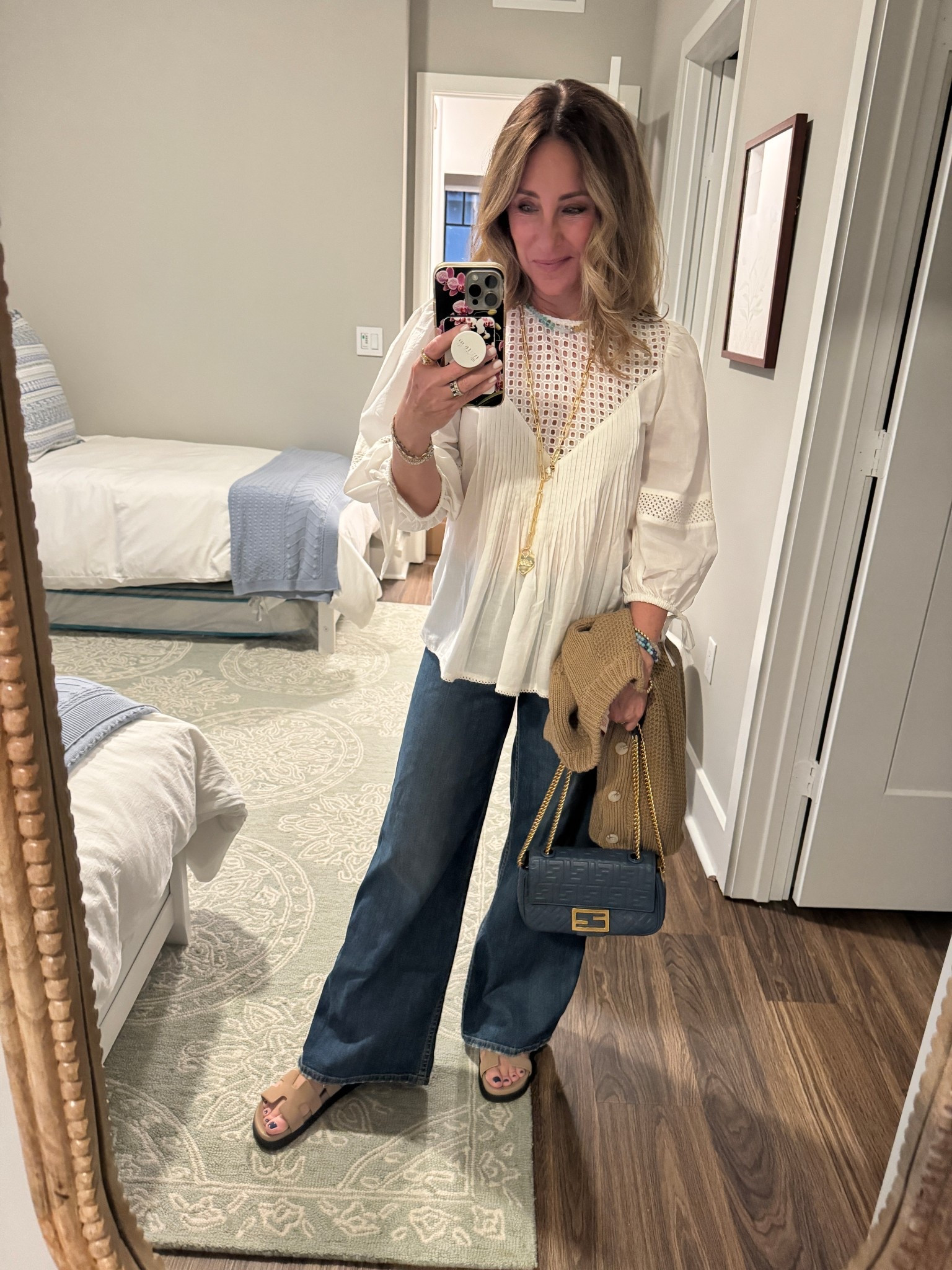 Dinner plans with friends.
I always love wearing a white shirt and denim. When I saw this fun one with the eyelet top, I had to order it. I really like how it’s classic but with a little different silhouette. And I’m just wearing a nude bra and you don’t see anything on top.

#LTKgrwm #LTKmomlife #LTKootd
