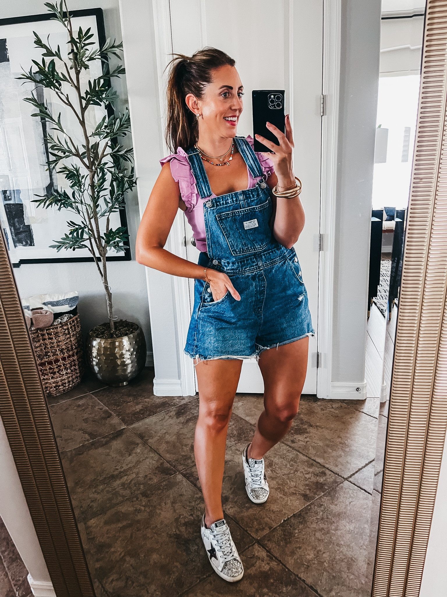 Ruffled tank top with short overalls! Love how the ruffles look under the straps! 💜Wearing a size small in both!

Casual summer style, summer outfit, Old Navy, Levi’s, overalls, outfit, summer style 

#LTKStyleTip #LTKSaleAlert #LTKFindsUnder50