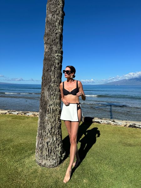 This white wrap sarong is so chic with its minimalist black trim! I wore it with my super fluttering bikini! This is the perfect beach vacation look! 

#LTKfindsunder100 #LTKstyletip #LTKswim