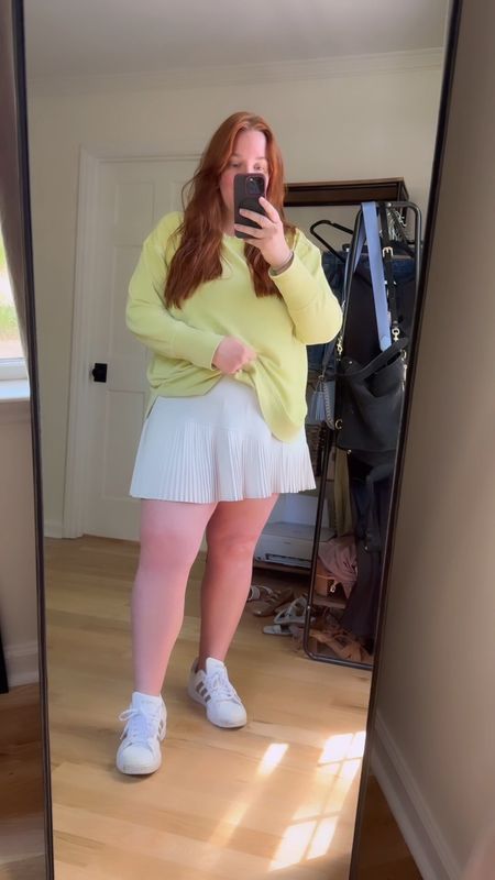 Cute but comfy tennis inspired travel outfit with neon sweatshirt and asymmetrical hem pleated tennis skirt. Paired it back to my adidas sneakers. Wearing a size 1X in the skirt. It’s on final sale for $44 (50% off).

#LTKsalealert #LTKActive #LTKplussize