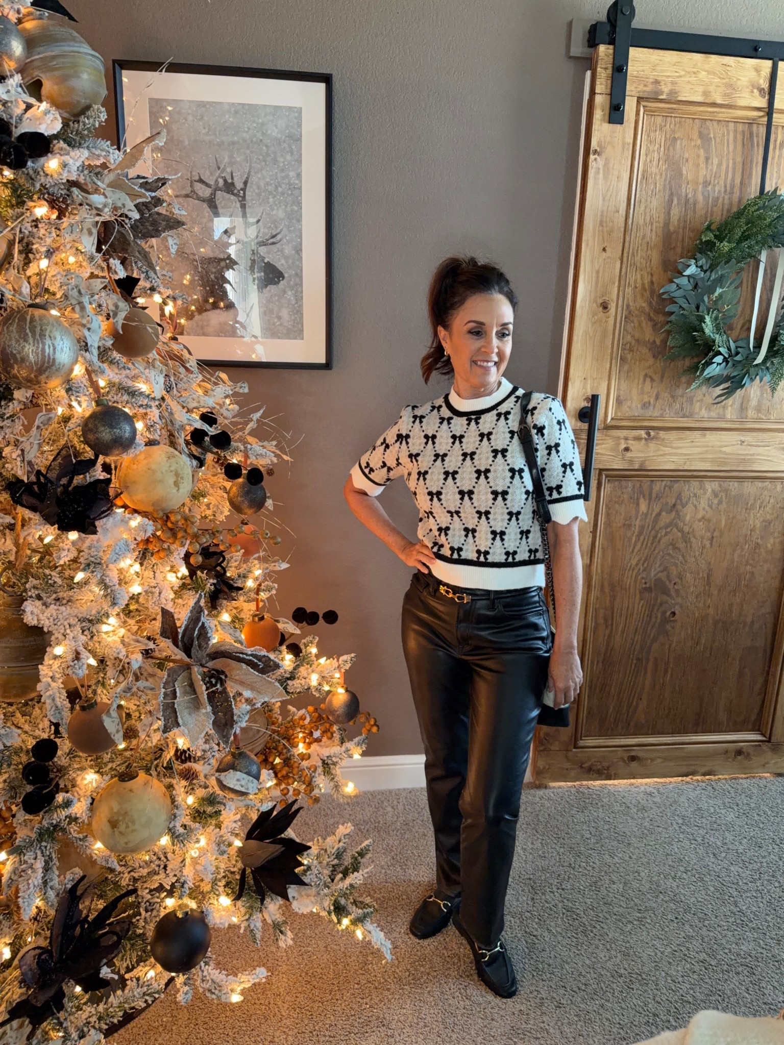 Festive holiday black and white outfit, bow sweater, Christmas outfits, Christmas sweater  

#LTKHoliday #LTKOver40 #LTKSeasonal