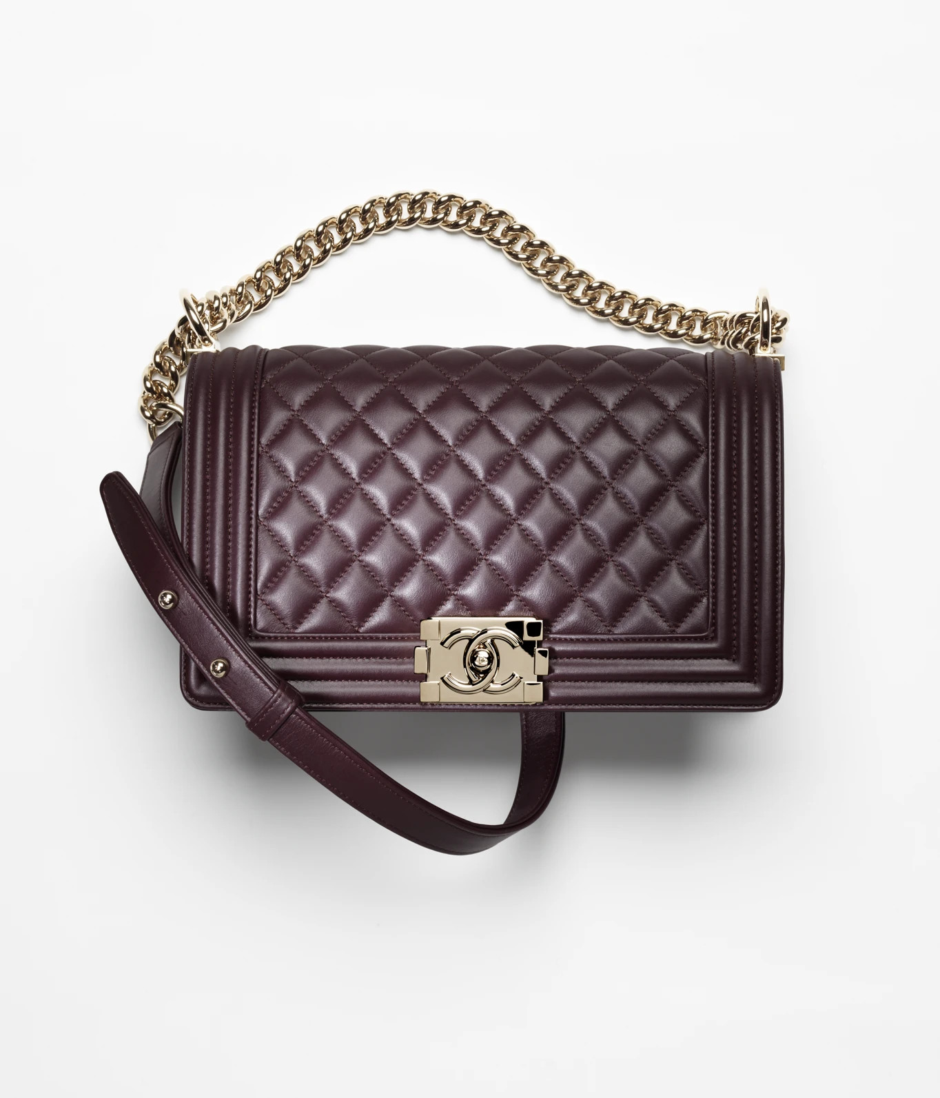 BOY CHANEL Handbag

            
		Calfskin & Gold-Tone Metal
	
		Dark Purple | Chanel, Inc. (US)