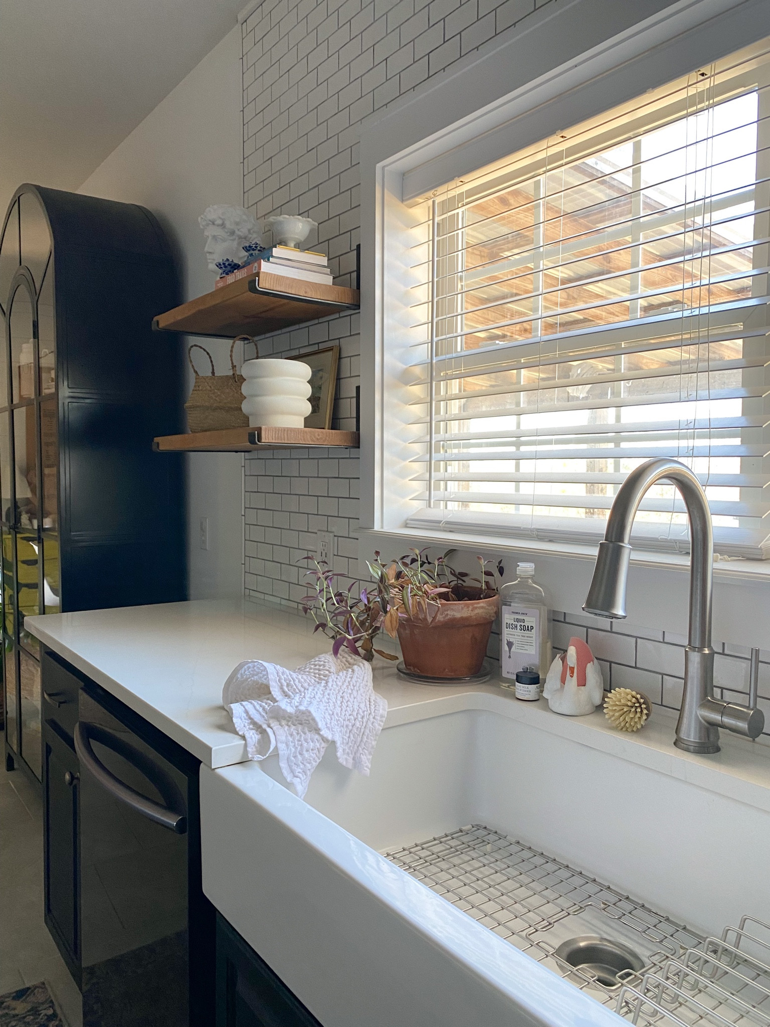 Swan sponge holder, kitchen decor 
Black arch cabinet, farm sink, tall faucet, iron shelf brackets
Bubble planter from Walmart 
Amazon, Home Depot 

#LTKhome #LTKFind #LTKunder50