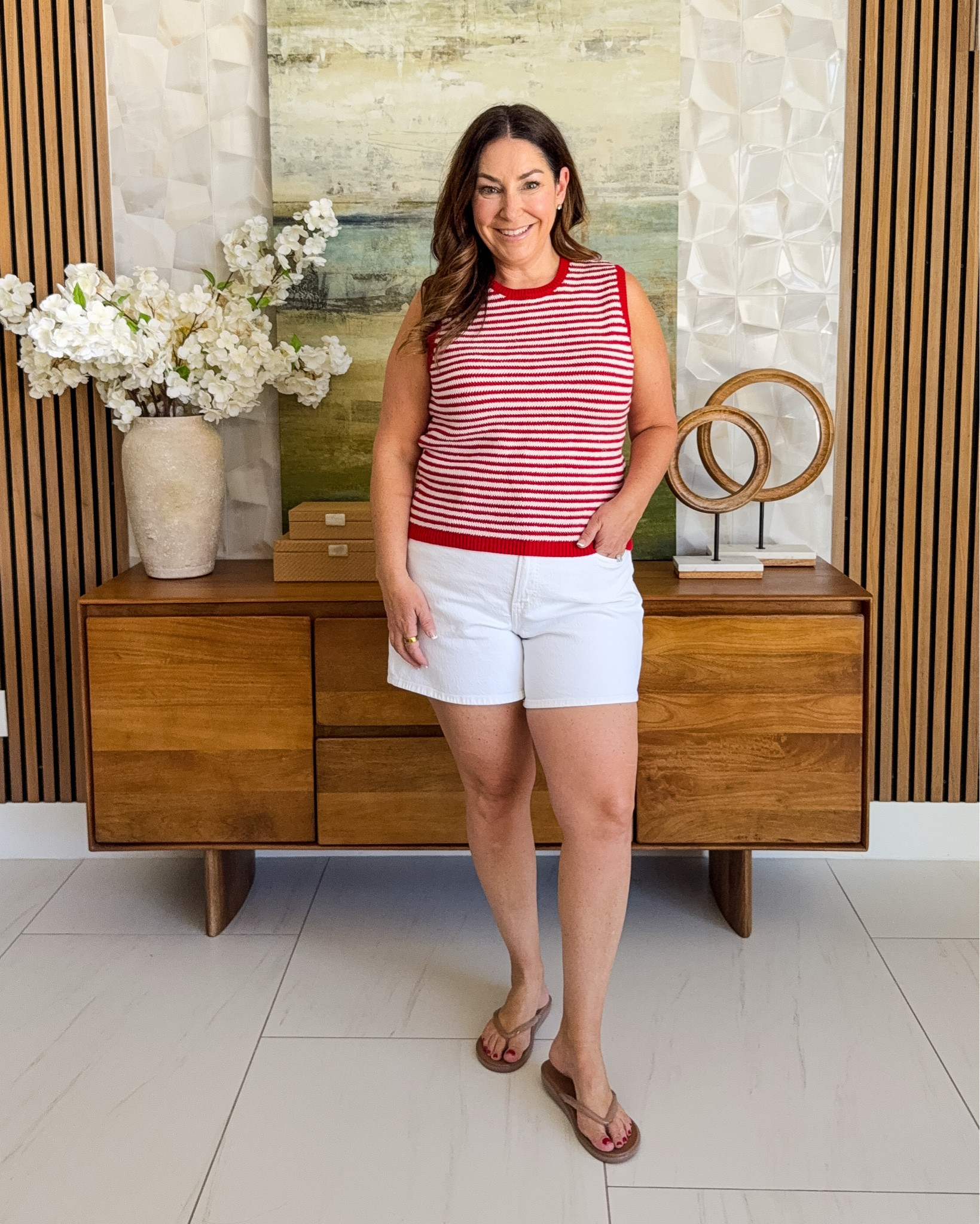 Nautical but nice 🐚❤️ This red and white striped sweater tank is a summer STAPLE. Pair it with white denim shorts and flip flops and I'm ready for warm weather! | Wearing tts, L // shorts are only ok wearing 32 they have a 5" inseam

#LTKSeasonal #LTKOver40 #LTKMidsize