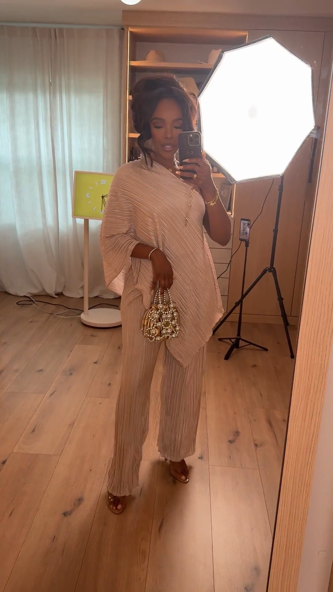 Hi Babes! ✨

This set is giving effortless elegance. The flowy pleated fabric, one-shoulder silhouette, and soft champagne tone make it the perfect look when you want to feel elevated without sacrificing comfort. Paired with a statement bag and gold accessories, this outfit looks far more expensive than it is.

✨ FIT DETAILS
• Two-piece pleated set
• One-shoulder draped top
• Wide leg flowy pants
• Lightweight fabric
• Relaxed fit
• True to size

✨ WHERE TO WEAR THIS
• Vacation dinners
• Resort nights
• Wedding guest events
• Bridal showers
• Birthday celebrations
• Date nights

✨ ACCESSORIES
• Pearl statement handbag
• Gold jewelry
• Neutral heels or sandals

Everything is linked below!

xx Kira | IG: KirasFashionFinds

Measurements: 5'4" | 140 lbs | Size Small