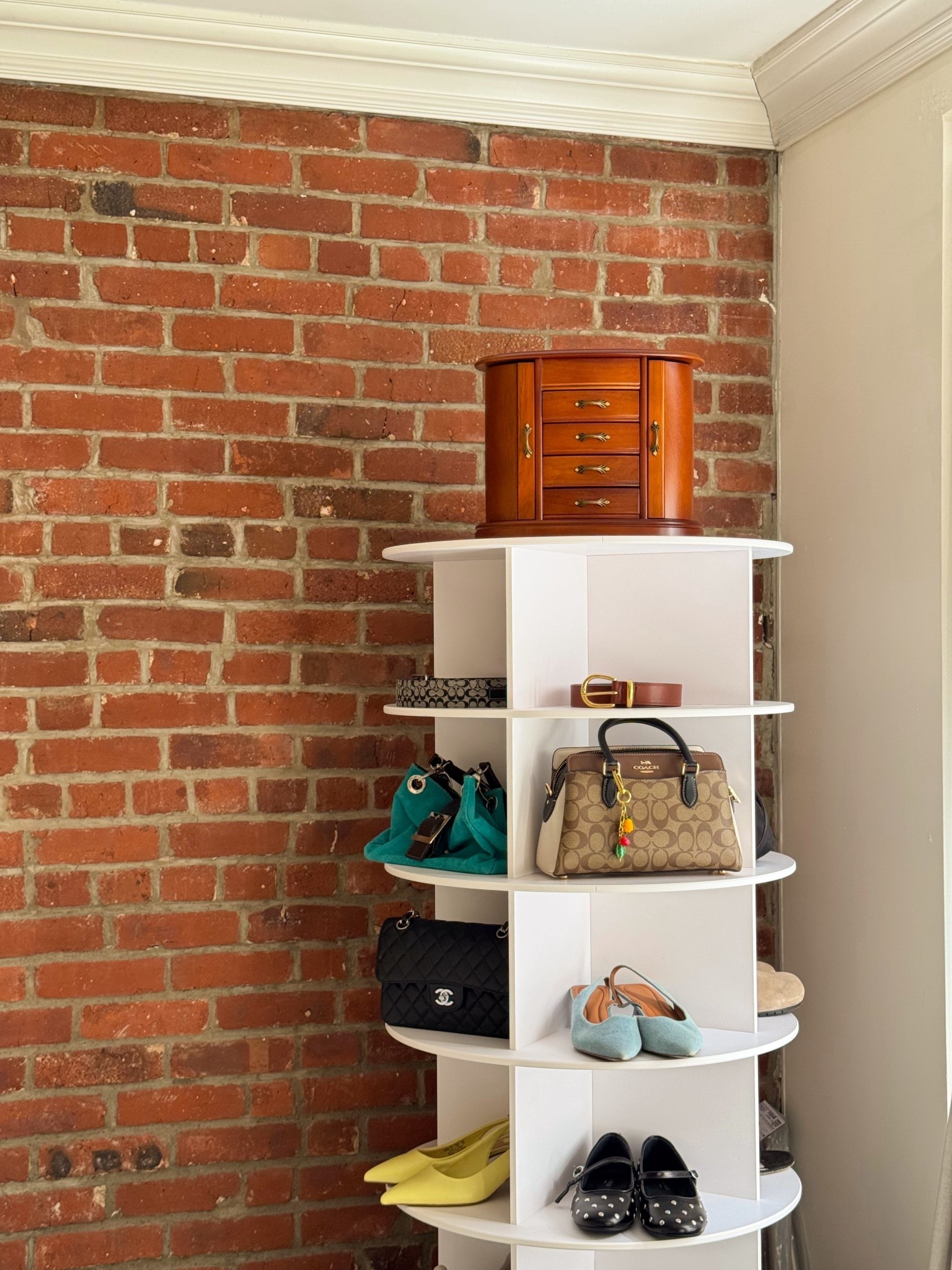	“My new favorite organization hack 🫶 A rotating shoe + accessory rack so I can actually see everything I own.