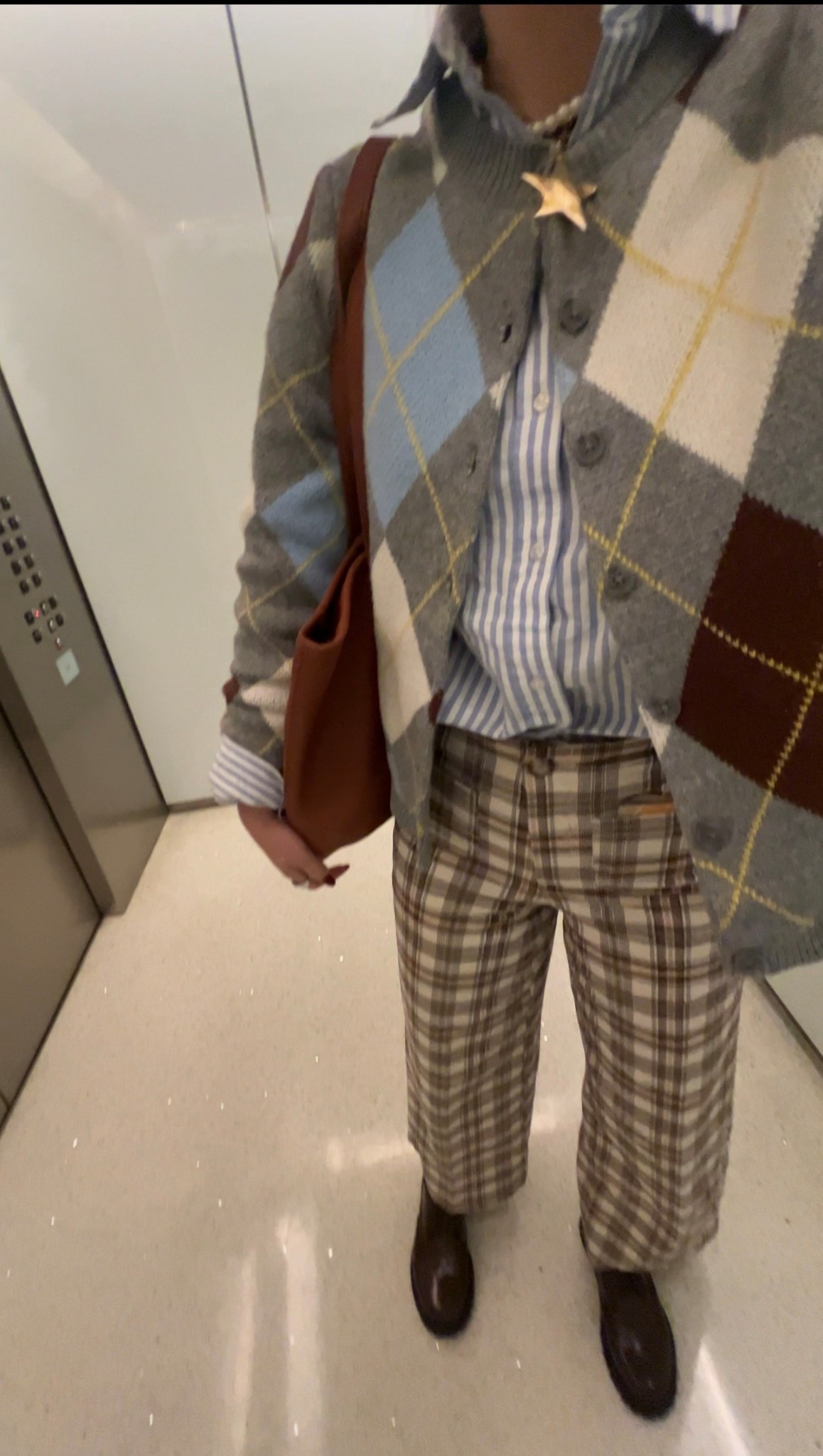 Tuesday work fit!!!! 
Argyle sweater striped button down, plaid pants, black Gucci boots, regular stack

#LTKWorkwear #LTKFindsUnder100 #LTKootd