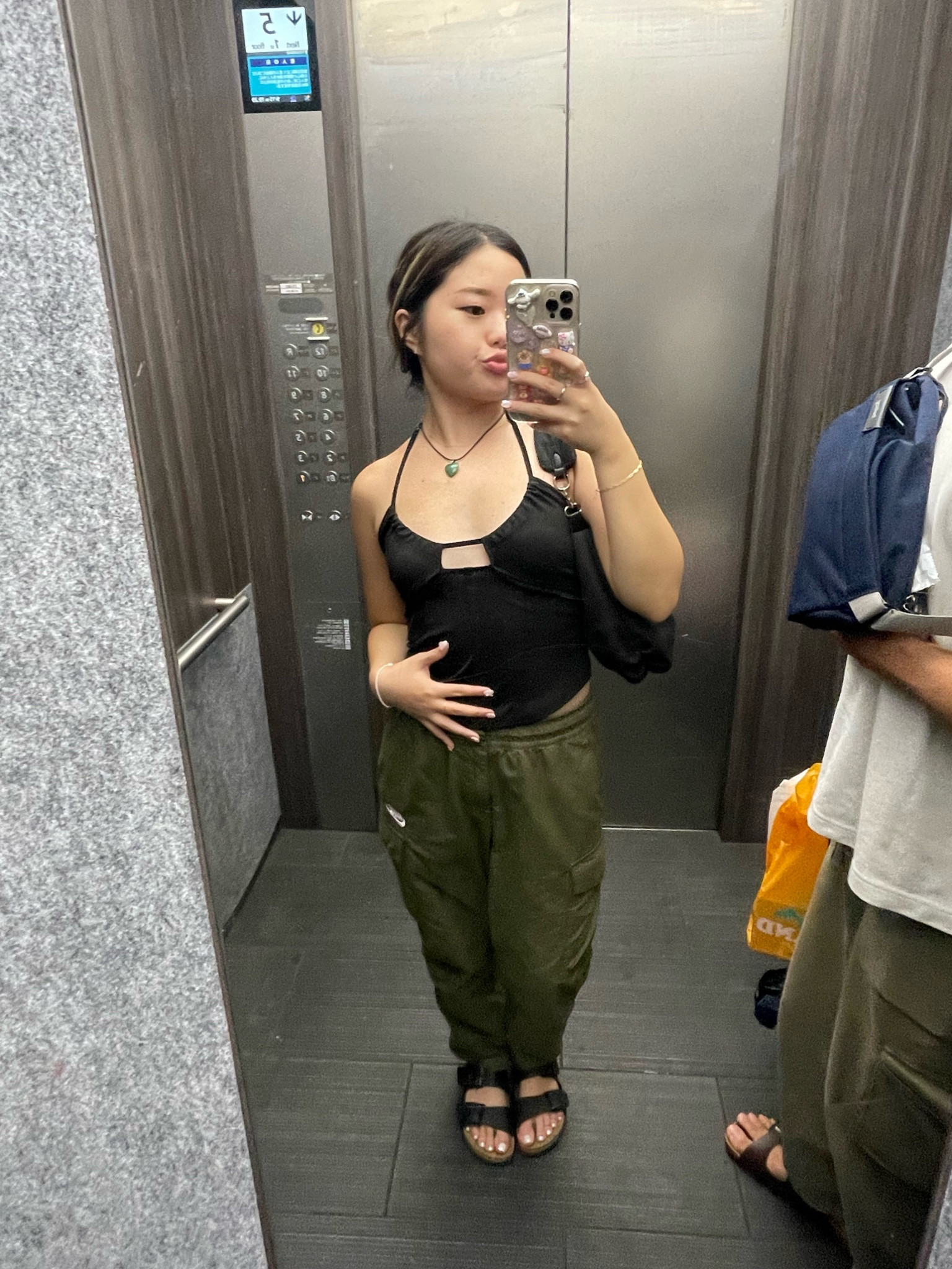 summer fall transition outfit cargo pants black tank top chunky heart necklace 

#LTKstyletip #LTKSeasonal #LTKtravel