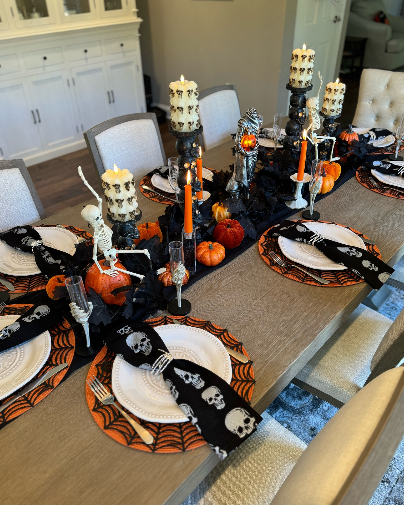 Halloween table, Halloween table setting, Halloween party, Halloween champagne glass, Halloween party cup, Halloween decorations, Halloween place setting, Halloween candles, Halloween LED candle, Halloween napkins, Halloween napkin rings, dining room table, dining room chairs, faux pumpkins, Halloween placemats, spiderweb placemats, poseable skeletons, cute Halloween table, decorating, seasonal decor, seasonal dining room, seasonal table decor 

#LTKSeasonal #LTKHome #LTKHalloween