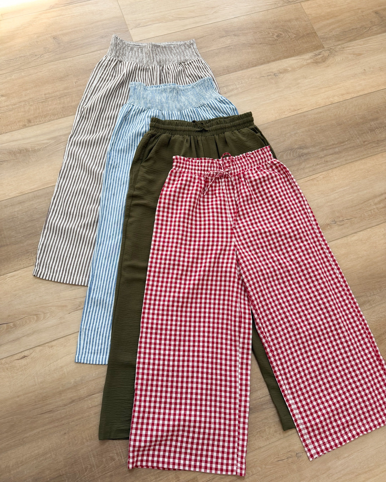 Okay I need to paint you a picture — it is a hot summer morning, you have a million things to do, and you reach for these lightweight stripe pants, tuck in a simple white button front tank, slide on your sandals, and walk out the door looking like you planned that outfit for a week 🤍✨ That is the magic of these Amazon wide leg pants and that is exactly why I own them in multiple colors. The blue stripe is my current obsession but the red gingham and olive are calling my name too. Lightweight, breezy, and they pack perfectly for travel.

#LTKootd #LTKSeasonal #LTKTravel