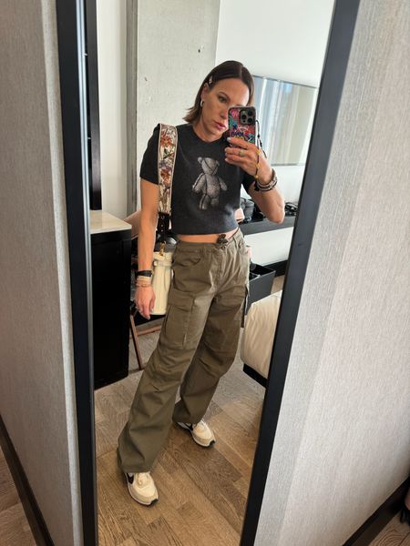 Army green wide leg cargos. Short sleev sweater shirt and some Nike sneakers. The ultimate comfy and cute outfit to tour a new city in! Topped off with my Dior bag and new floral strap.Wearing size small in shirt. Size 25 in pants. Size 7.5 in sneakers. 

#LTKtravel #LTKover40 #LTKstyletip