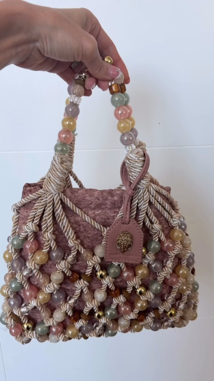 Add a playful statement piece to your wardrobe with the Kurt Geiger London Mini Beaded Macrame Rope Bucket Bag 👜✨! Featuring intricate beaded and macrame details, this eye-catching bag brings texture and personality to any outfit 💕 Perfect for vacations, brunch dates, special occasions, or adding a fun touch to your everyday look. A stylish accessory that's definitely worth adding to your bag collection! ✨

#KurtGeiger #KurtGeigerLondon #BucketBag #BeadedBag #MacrameBag #HandbagLove #StatementBag #FashionFinds #BagLover #Accessories #EverydayStyle #StyleInspo #OOTD #FashionAccessories #WardrobeEssentials #LTKFashion #LTKFinds #MustHaveFinds #TrendingStyle #ChicStyle #VacationStyle #SummerAccessories #FashionLover #BagCollection #StyleGoals 

 