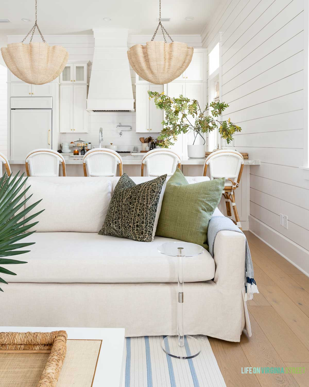 Coastal home living room decor // chandelier // throw pillows // coffee tables // trays // faux stems  

 #LTKSeasonal #LTKHome