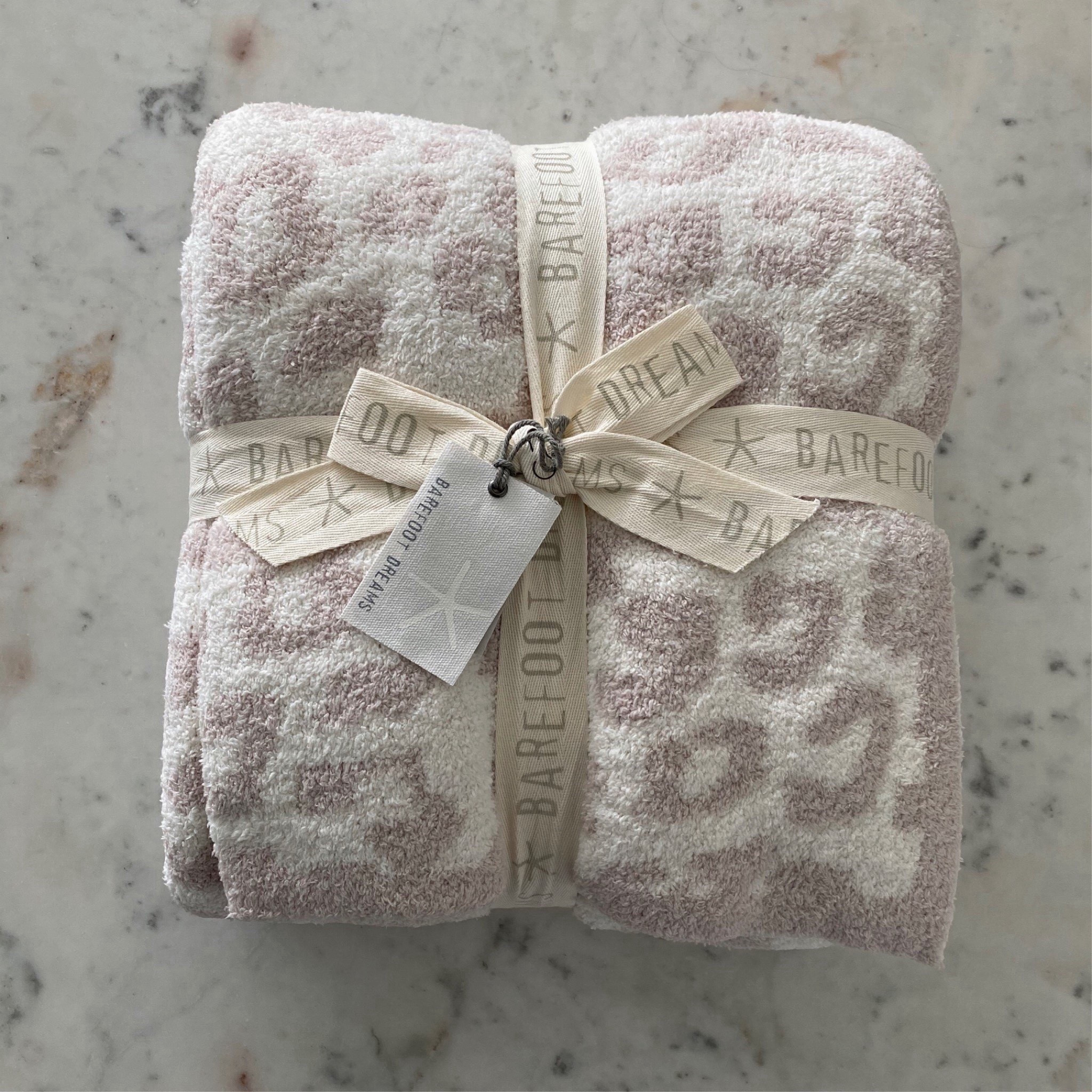 Barefoot dreams throw now $41 originally $170