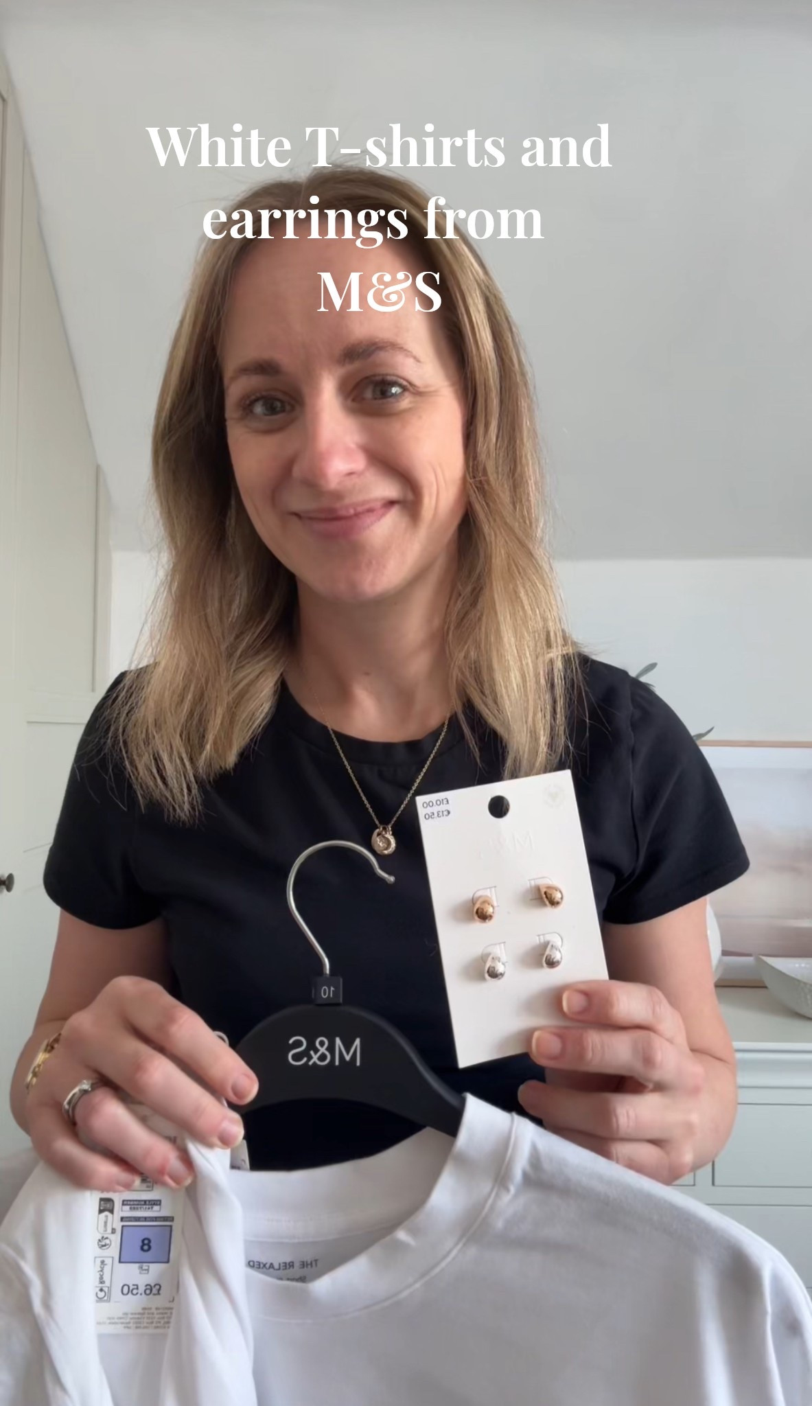 White T-shirts and earrings from M&S