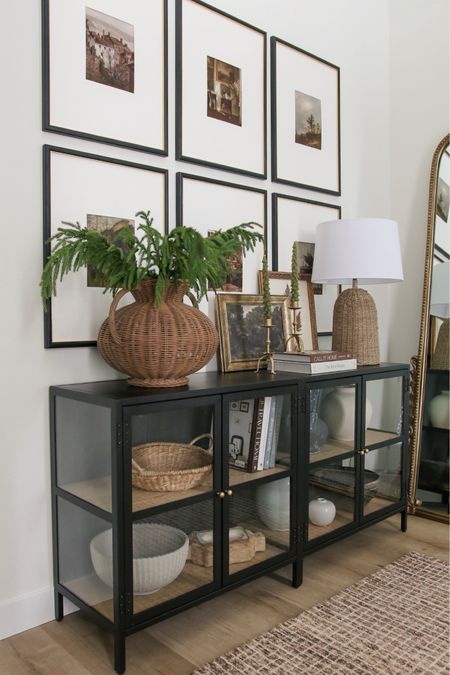 My glass cabinets are back in stock and a favorite from January! I used two here and flipped the backing around so it shows black (instead of faux wood like the stock image). My gallery frames were another best seller!

#LTKMostLoved #LTKhome #LTKstyletip