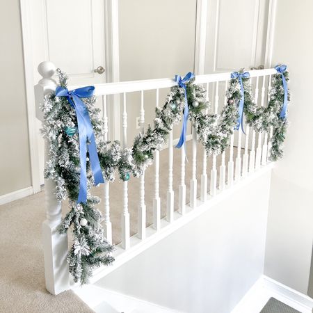 I cannot tell you how much I love this flocked holiday garland. It looks so luxe & has been a holiday decor staple of mine for several years now. This is the fourth year I’ve put up this garland & it still looks as good as day 1! Grandmillennial, coastal, Christmas, blue & white, chinoiserie, satin ribbon, bows, pastel Christmas. I also have the matching wreaths & the more full pine cone garland for my fireplace mantle  

#LTKHoliday #LTKfindsunder50 #LTKhome