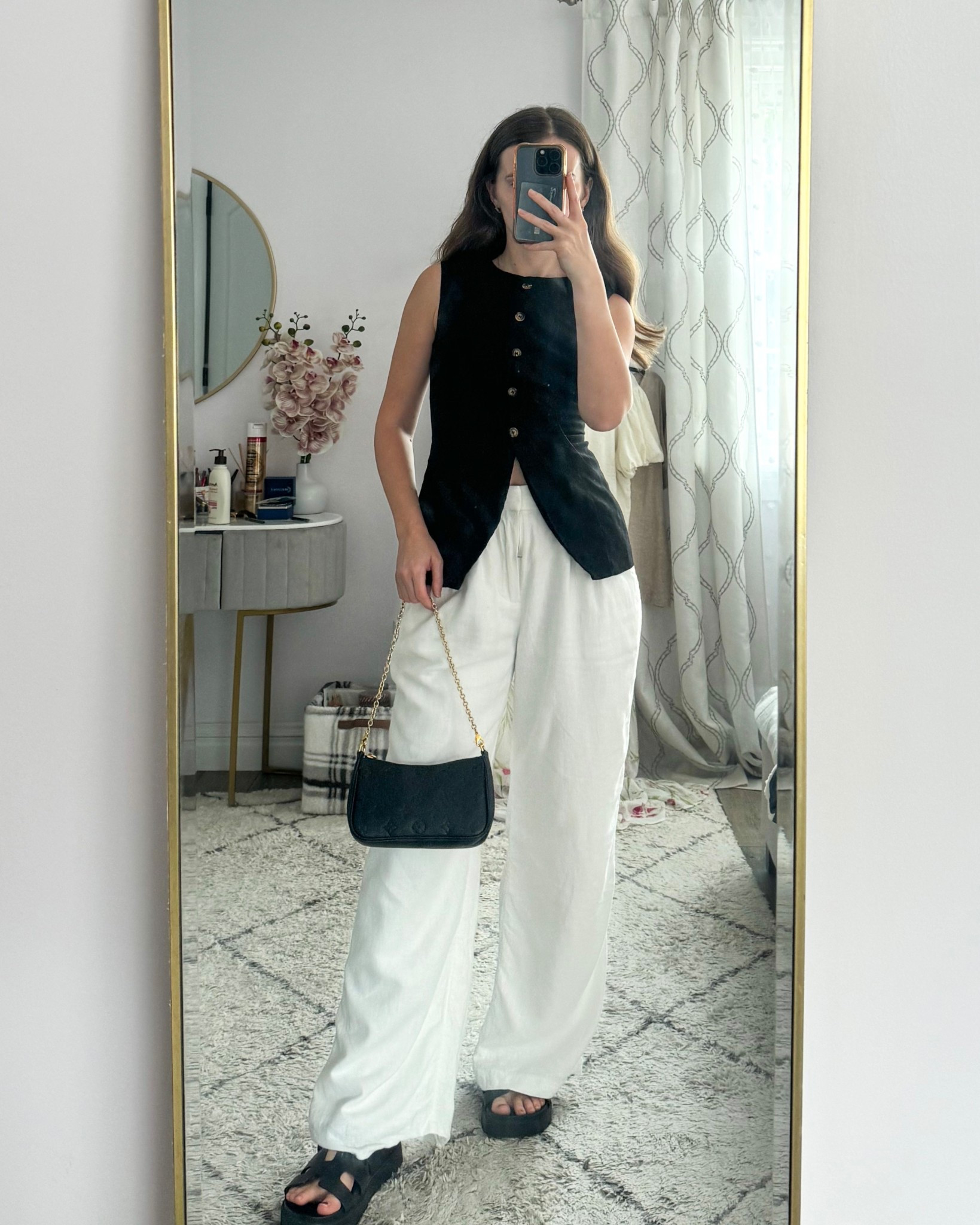 Linen pants are my summer go-to and I’m loving this black vest with them for an easy, pulled-together look. Threw on my favorite black sandals and a shoulder bag—perfect for coffee runs, casual dinners, or just looking cute while staying cool.
.
.
.
.
#LTKWorkWear #LTKStyleTip #LTKTravel #LTKShoeCrush #LTKItBag 

Summer outfits | summer tops | cute tops | black top | linen top | vest top | vest outfits | linen pants outfit | summer pants | summer shoes | summer sandals | black sandals | platform sandals | casual sandals | classy outfit | dressy outfit | outfit inspo | outfit ideas | white pants outfit | black shoulder bag | summer bag | 

#LTKSummerEdit #LTKFindsUnder50 #LTKFindsUnder100 #LTKSaleAlert #LTKU #LTKGiftGuide #LTKSeasonal #LTKPetite