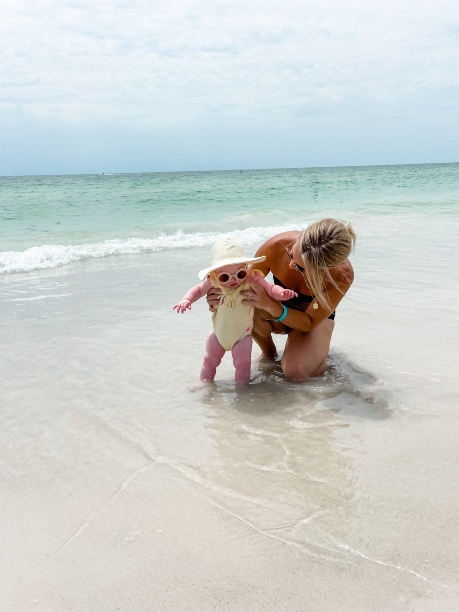 6 months! This was Journeys first time at the beach 🌊!! She loved it! Swimsuits are TTS! Absolutely love her suit & matching hat, SPF 50 + she was soo comfy in it too. And the sunnies 🥹🫶🏻 can barely handle her cuteness. 

Beach day | baby beach day | baby girl | baby girl swimsuit | baby swim | babygirl bikini | baby girl swimwear | baby girl beach day | beach baby | family beach trip | family vacation | beach essentials | baby travel | kids swim | baby swim | kids swimsuits | florida baby | florida girls | florida baby girl swimsuit | kids swim | kids swimsuits | RuffleButts swimwear | baby swimwear | baby travel | baby beach day | black swimsuit | womens swimsuits | Amazon women swim | Amazon bikini | Amazon swimwear | Amazon swim | womens Amazon vacation style | Amazon beach 

#LTKswim #LTKbaby #LTKbump