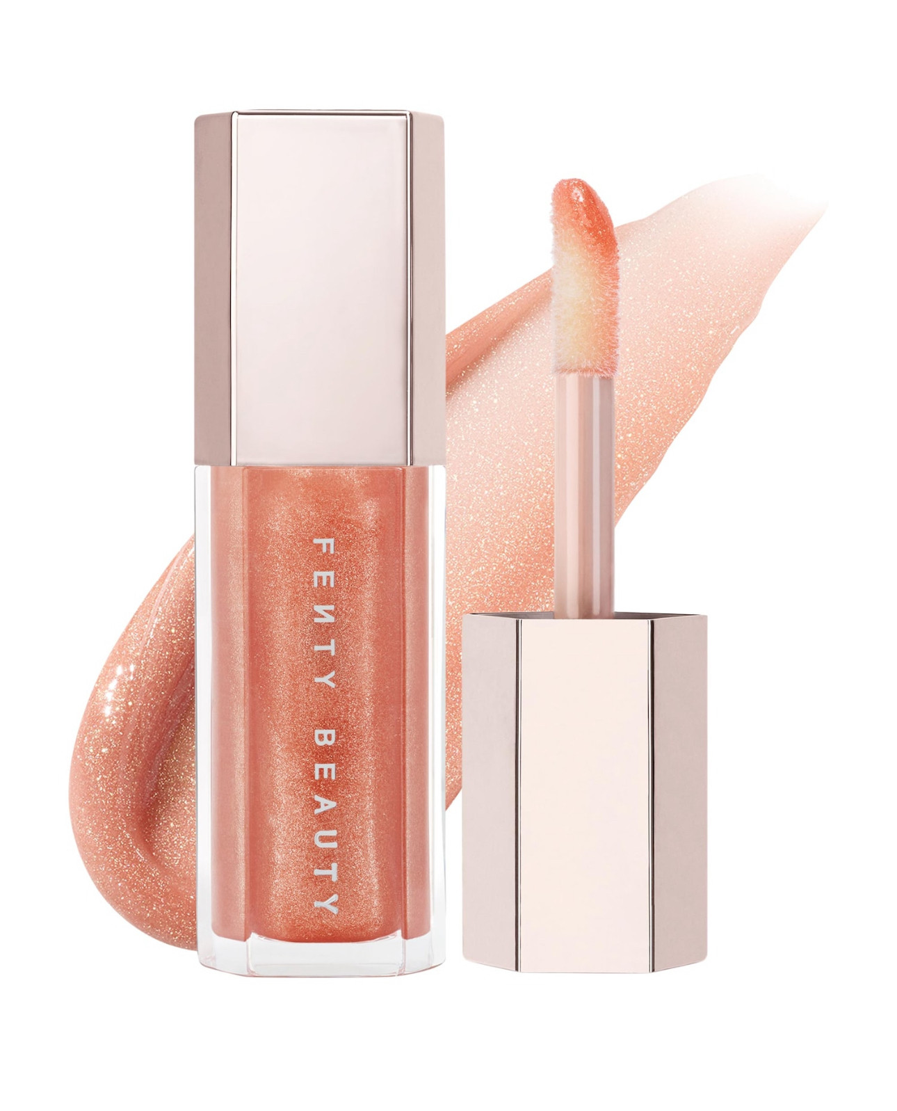 What it is: An ultimate, gotta-have-it lip gloss with explosive shine that feels as good as it looks.

Highlighted Ingredients: 
- Shea Butter: Conditions skin.

Ingredient Callouts: Free of parabens and phthalates. This product is also cruelty-free.

What Else You Need to Know: This universal lip luminizer delivers explosive shine in six shades that flatter all skin tones. One swipe of Gloss Bomb’s XXL wand leaves lips looking instantly fuller and smoother. The non-sticky formula is super shiny, and has an addictive peach-vanilla scent you just can't get enough of. Rihanna was obsessed with creating the perfect gloss that makes you want to put it on over and over again. 
“I made it because I wanted the girls to get kissed more.”Rihanna, Brand Founder

#LTKselfcare #LTKmorningroutine #LTKBeauty