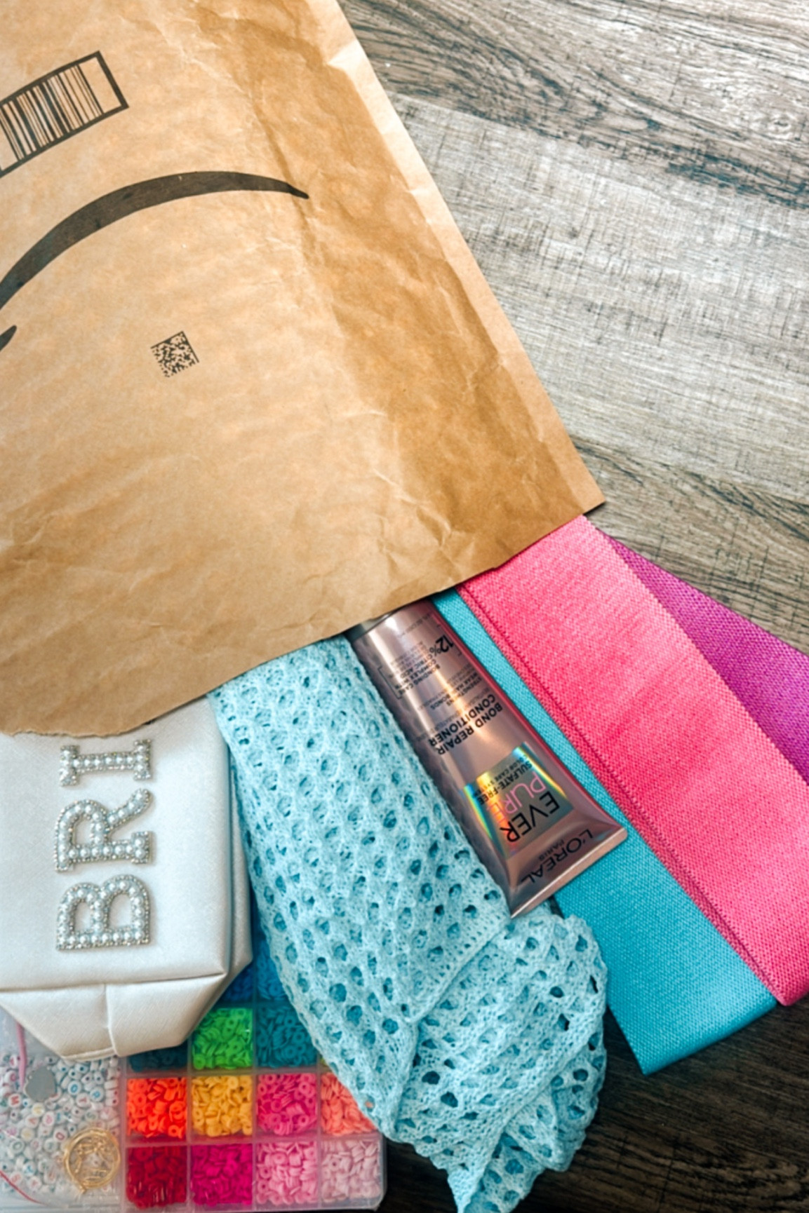 Open my Amazon package with me! Here’s what I got
- beaded pearl BRIDE makeup case
- beach blue swimsuit coverup for my cruise vacation!
- bonding repair conditions for my hair health
- workout resistance bands to excersice from home when I can’t make it to the gym
- bead bracelet kit for making friendship bracelets 

#LTKwedding #LTKswim #LTKtravel