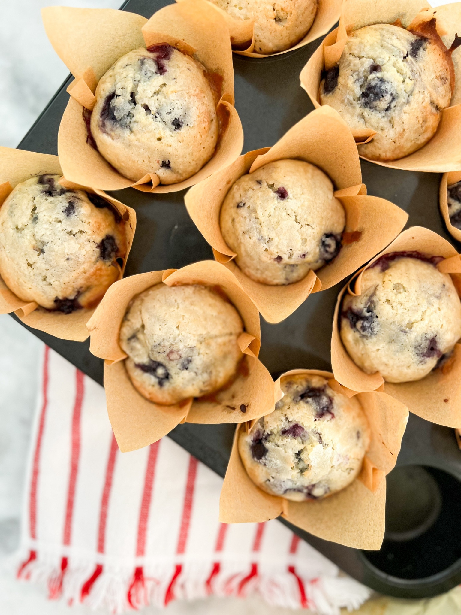 Simple Homemade Blueberry Muffins 
2 cups blueberries (frozen or fresh)
2 cups all purpose flour
2 tsp baking powder
1 cup (plus 2-3 tbsp for sprinkling) sugar
1/4 tsp salt
2 eggs
3/4 cup milk
1/2 cup butter ( French butter 👌🏼)
1 tsp vanilla extract

🫐 Preheat oven to 375 and prep a 12 cup muffin pan with liners ( grabbed these from Walmart)
🫐 Cream the butter some before adding the sugar. I used a fork, but a mixer will also be good!
🫐 After creaming the butter and sugar, add the vanilla and mix. Then mixing in the milk. 
🫐 Add the eggs, one at a time, incorporating the first one in before adding the second egg.
🫐 In a separate bowl, mix the flour, salt, and baking powder.
🫐 Add half the flour mixture to the butter mixture and mix, then add the rest of the flour mixture.
🫐 Mix until everything is just incorporated, then fold in the blueberries. 
🫐 Fill each muffin cup about 3/4 full with the batter, then sprinkle the reserved sugar on top of each one.
🫐 Bake for ~15 minutes or until edges are lightly browning and the middle is set.
🫐 Don’t forget to add that butter slice to the middle 👌🏼

#LTKHome #LTKParties #LTKFamily