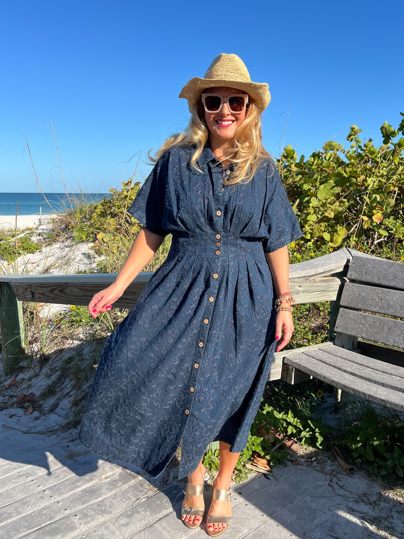 🏝️SOFT SURROUNDINGS: #ad Packing for a calm getaway? Here’s the dress you need! @soft_surroundings #softsurroundings 

👗My embroidered short sleeve midi dress flatterers with front and back tucks that define your waist. Love the tonal embroidery and beautiful floral pattern. You can wear this meeting friends for a lunch date, a beach getaway or everyday wear. Effortless style + versatility + breathable fabric = The dress you need!

🫶🏻Truly looks like a sophisticated denim dress. Buttons down the front, has side pockets and so soft! I’m wearing a medium and it fits true to size. Available in XS-3X. Color: Embroidered medium wash.

👒When heading out to the beach, don’t forget to pick up my Catalina Cowboy hat! This raffia hat features a colorful braided faux suede hatband and has an interior adjustable sweatband that makes it comfy. Also love the shapeable three inch brim to offer extra sun protection. 

🙌🏼In addition to my hat, I’m wearing a set of five bracelets with matching earrings. The genuine rhodonite beads in pinks, golds and earth tones look fantastic for spring and summer.

👡You can’t forget about these insanely comfortable textured sandals. Obsessed! This golden leather sandal has a soft shimmer and glow. Elevated and chic. You’ll be reaching for these all spring and summer long. I walked around all day and my feet felt great. Order your normal size. These are fantastic!

👉🏼Follow my shop @jtstjtst11 on the @shop.LTK app to shop this post and get my exclusive app-only content!

#liketkit 
@shop.ltk

#LTKSeasonal #LTKOver40 #LTKSaleAlert #LTKMothersDay #LTKTravel #LTKgrwm #LTKootd #LTKMidsize #LTKSwim #LTKFestival 